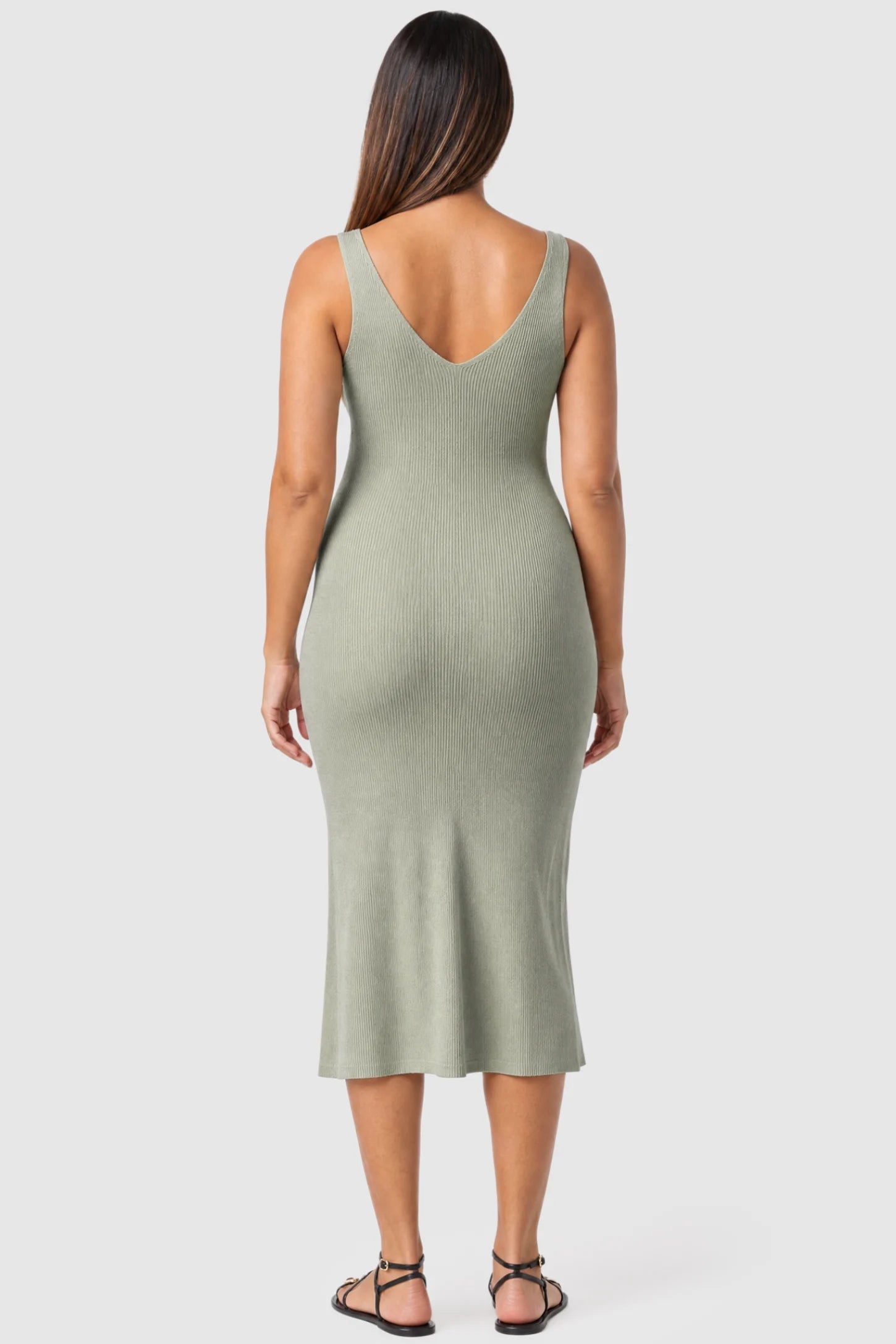 Lurex Shimmer V-Neck Sleeveless Maternity Midi Dress Lurex Shimmer V-Neck Maternity Midi Dress in beige featuring a high-stretch glitter knit on a pregnant model, back view.