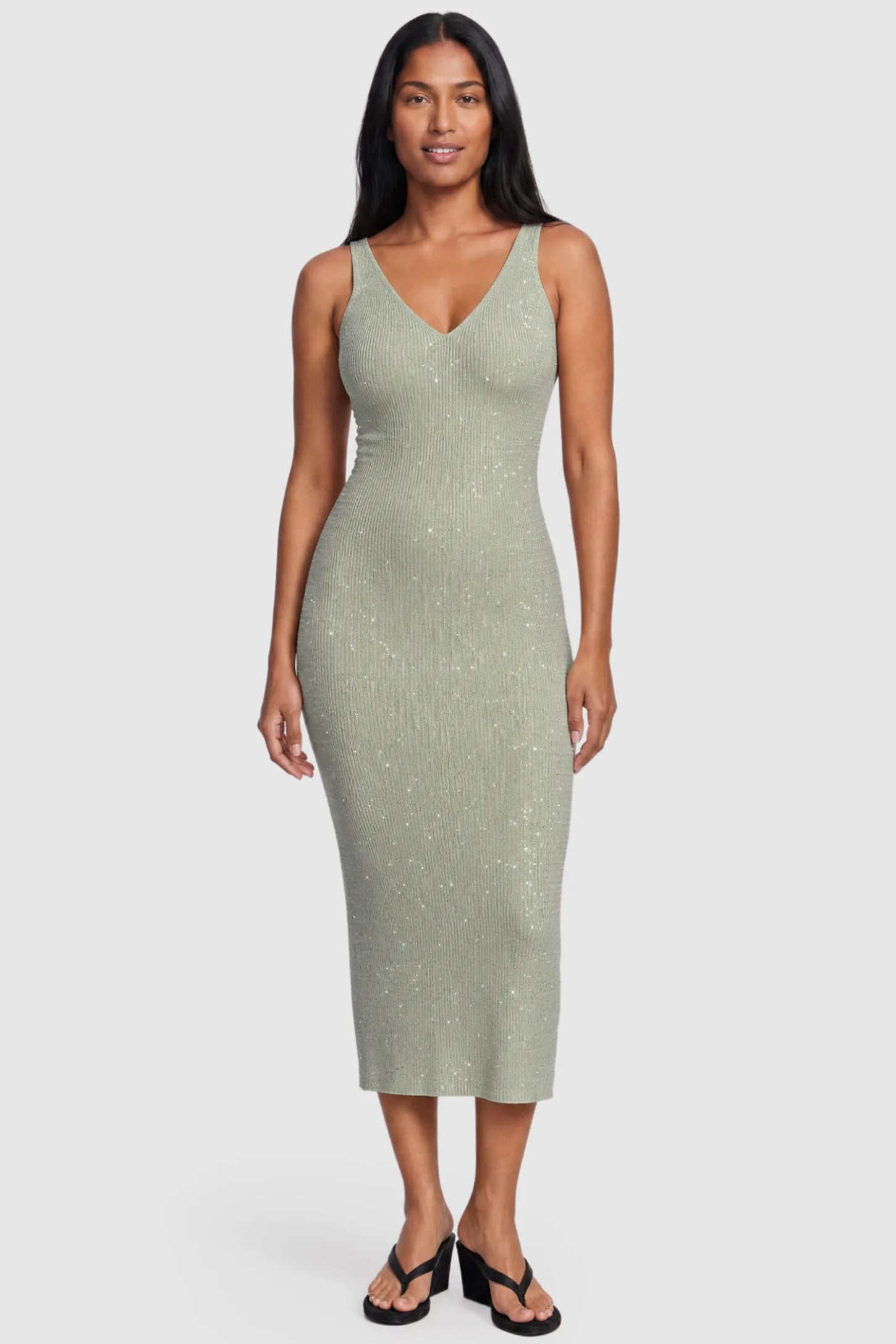 Lurex Shimmer V-Neck Sleeveless Maternity Midi Dress Lurex Shimmer V-Neck Maternity Midi Dress in beige featuring a high-stretch glitter knit on a postpartum model, front view.