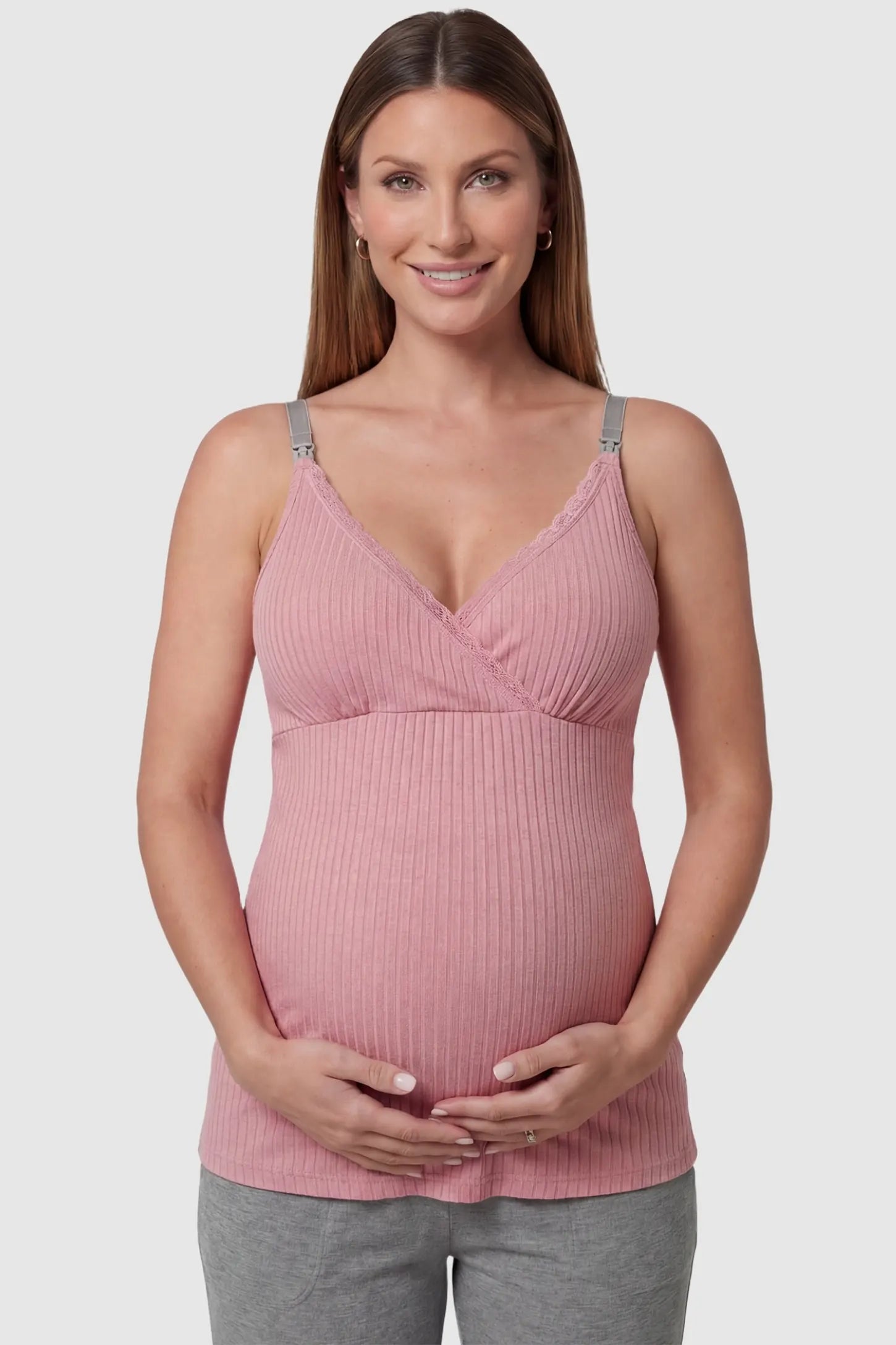 Padded Ribbed Maternity & Nursing Camisole Dusty Pink Padded Ribbed Maternity Camisole with lace-trim V-neckline on a pregnant model in a front view.