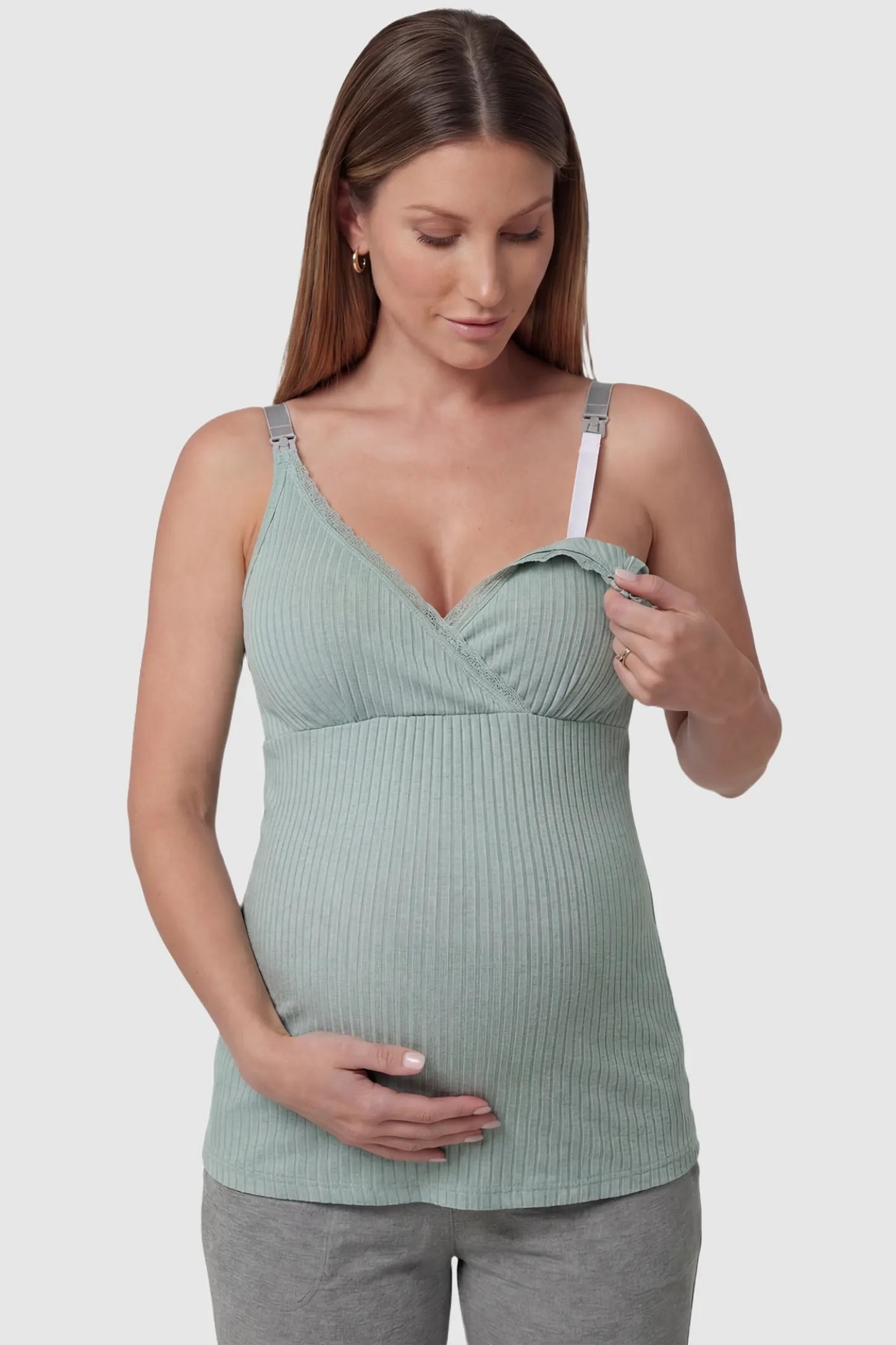Padded Ribbed Maternity & Nursing Camisole Pea Green Padded Ribbed Maternity Camisole with easy nursing access on a pregnant model in a front view.