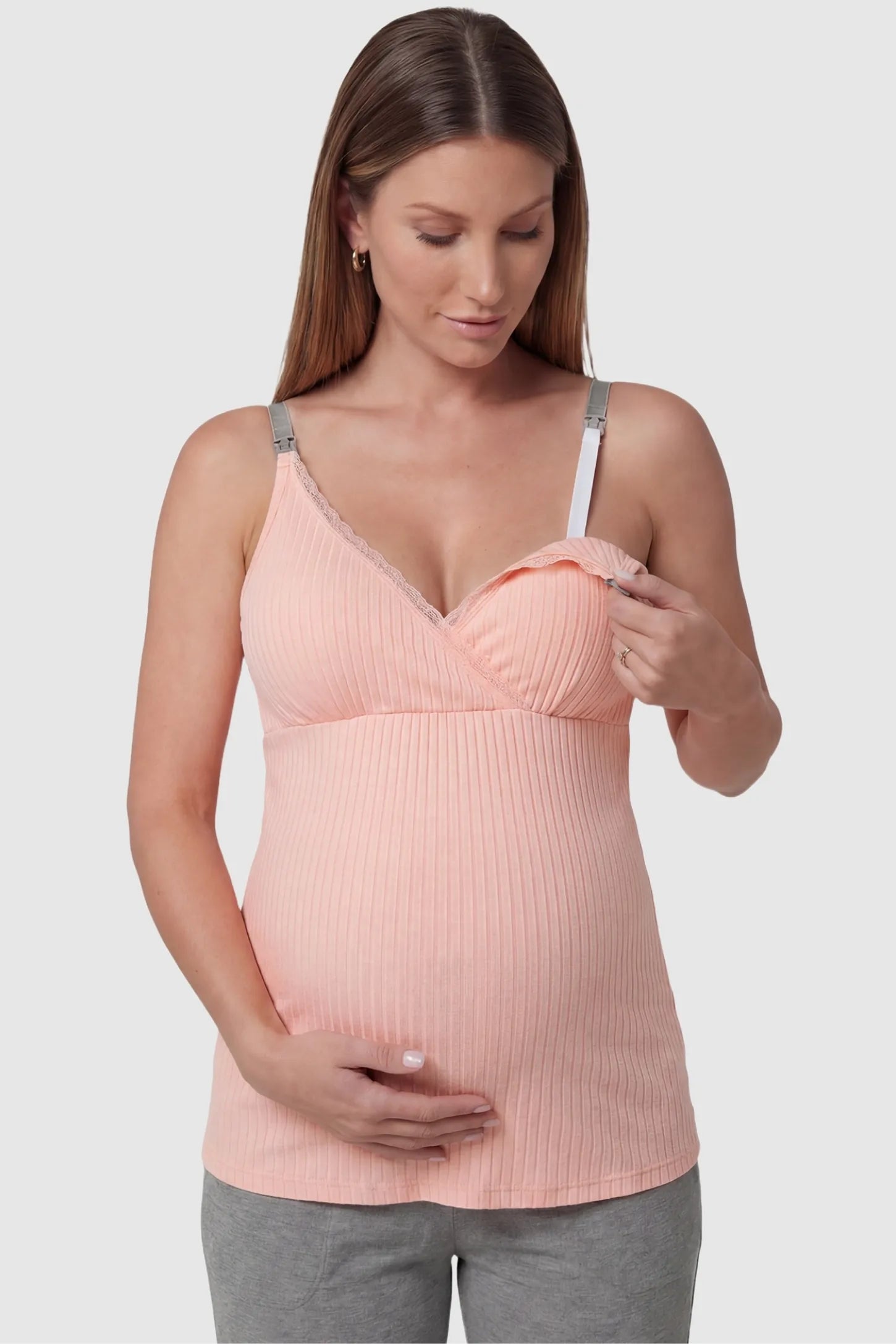 Padded Ribbed Maternity & Nursing Camisole Pink Padded Ribbed Maternity Camisole with easy nursing access on a pregnant model in a front view.