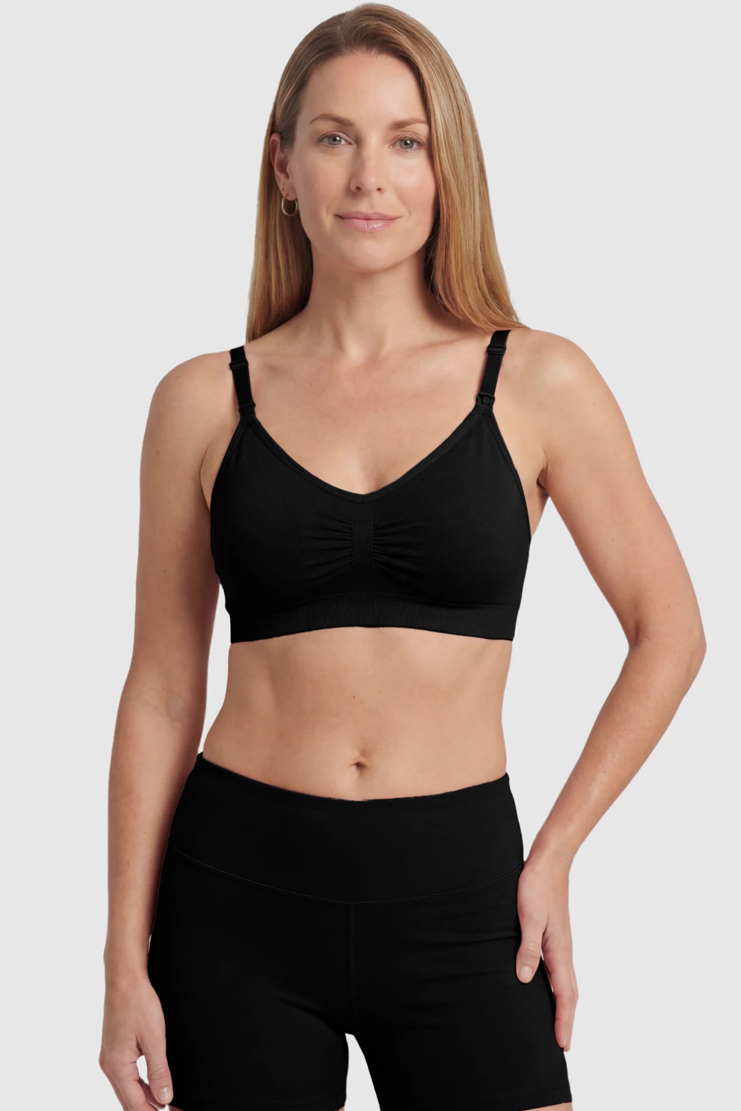 Seamless Ruched Front Maternity Nursing Bra Seamless Ruched Front Maternity Nursing Bra in black featuring ribbed fabric and drop-down clips on a postpartum model showing front.