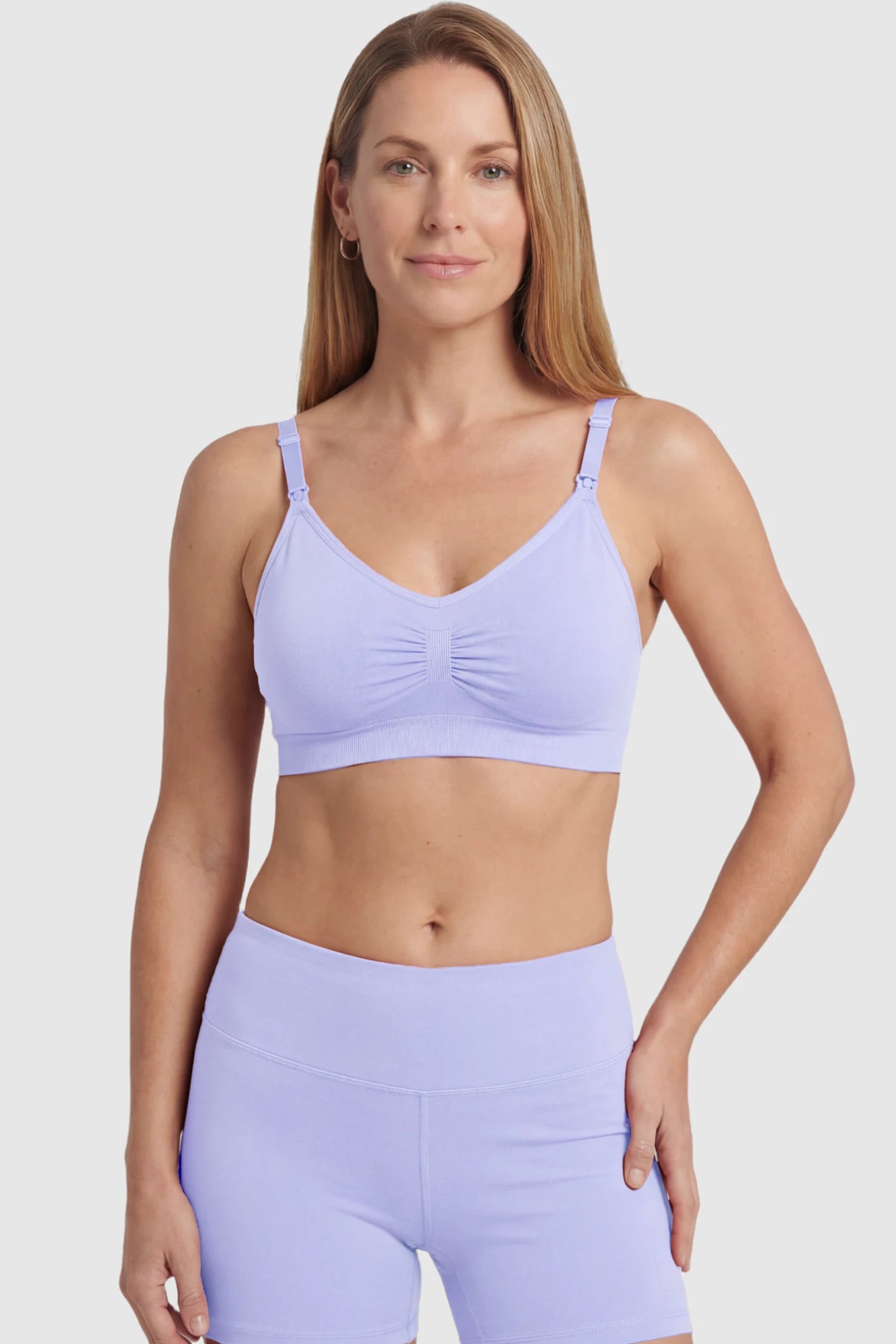 Seamless Ruched Front Maternity Nursing Bra Seamless Ruched Front Maternity Nursing Bra in blue featuring ribbed fabric and drop-down clips on a postpartum model showing front.