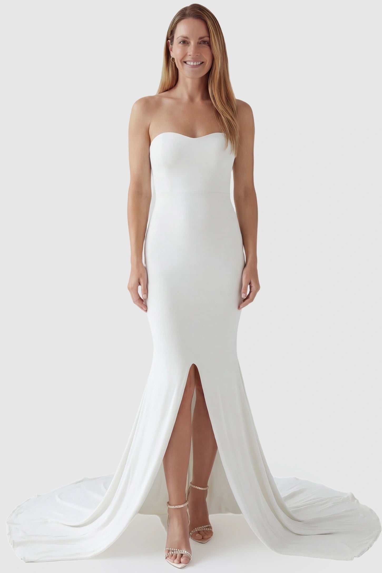 Strapless Sweetheart Neckline Trumpet Silhouette Maternity Gown Strapless Sweetheart Neckline Trumpet Silhouette Maternity Gown in White featuring a curve-hugging fit on a non-pregnant model.