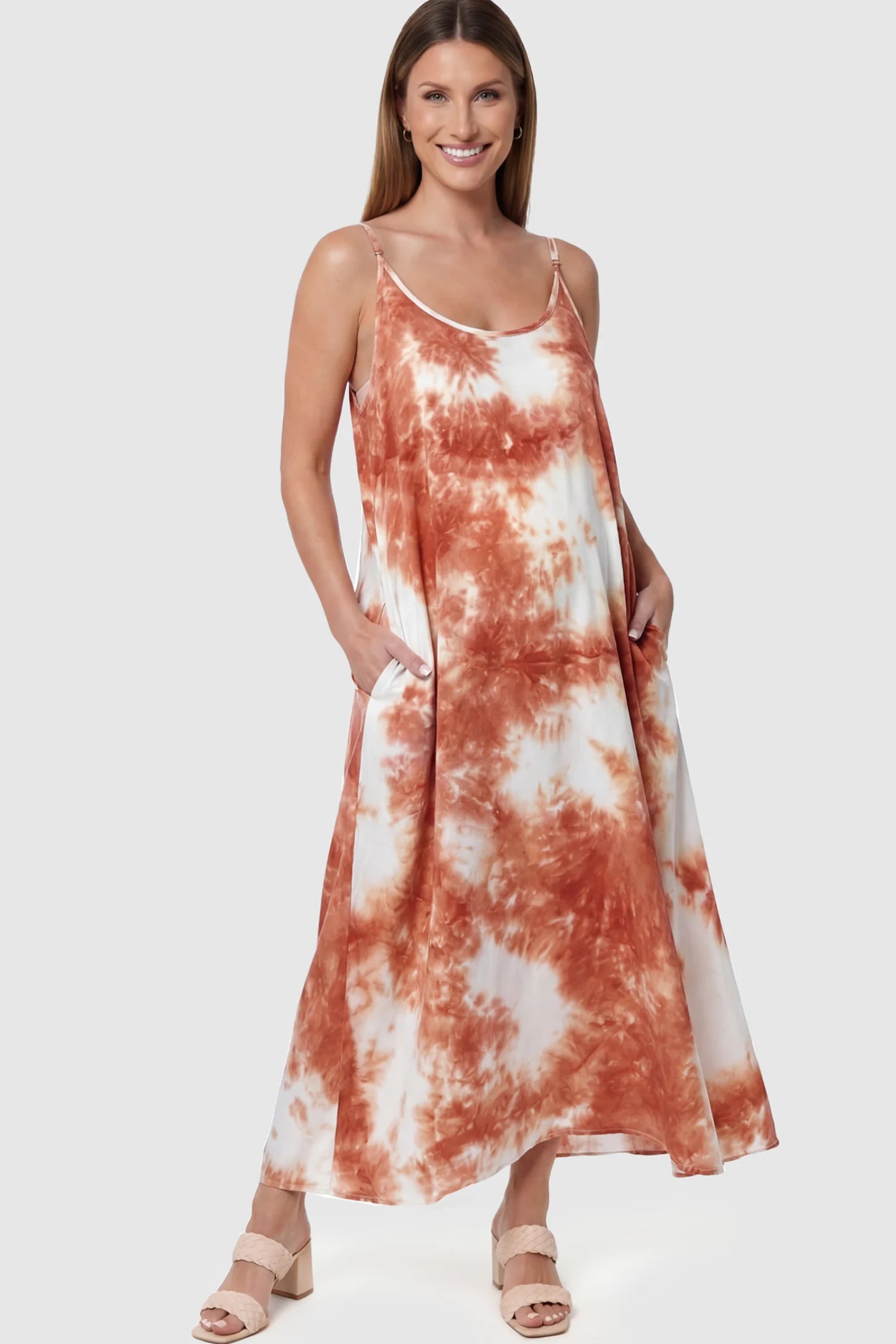 Tie-Dye Print Spaghetti Strap Maternity Maxi Dress in Pink and White featuring side pockets on a pregnant model posing front.