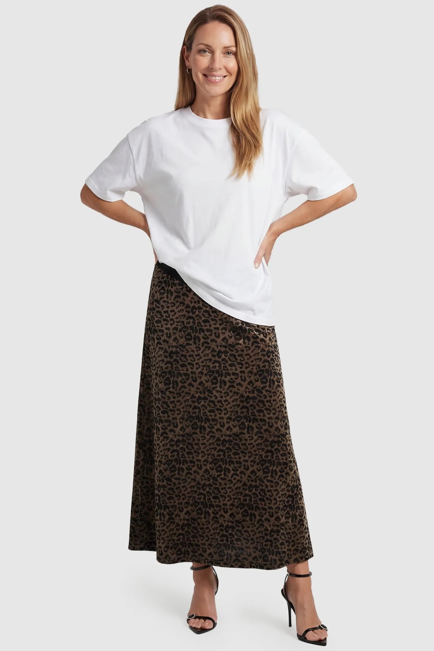 Leopard Print Velvet High-Waisted Maternity Maxi Skirt Leopard Print Velvet High-Waisted Maternity Maxi Skirt in Coffee front view featuring a versatile foldover waistband on a non-pregnant model.