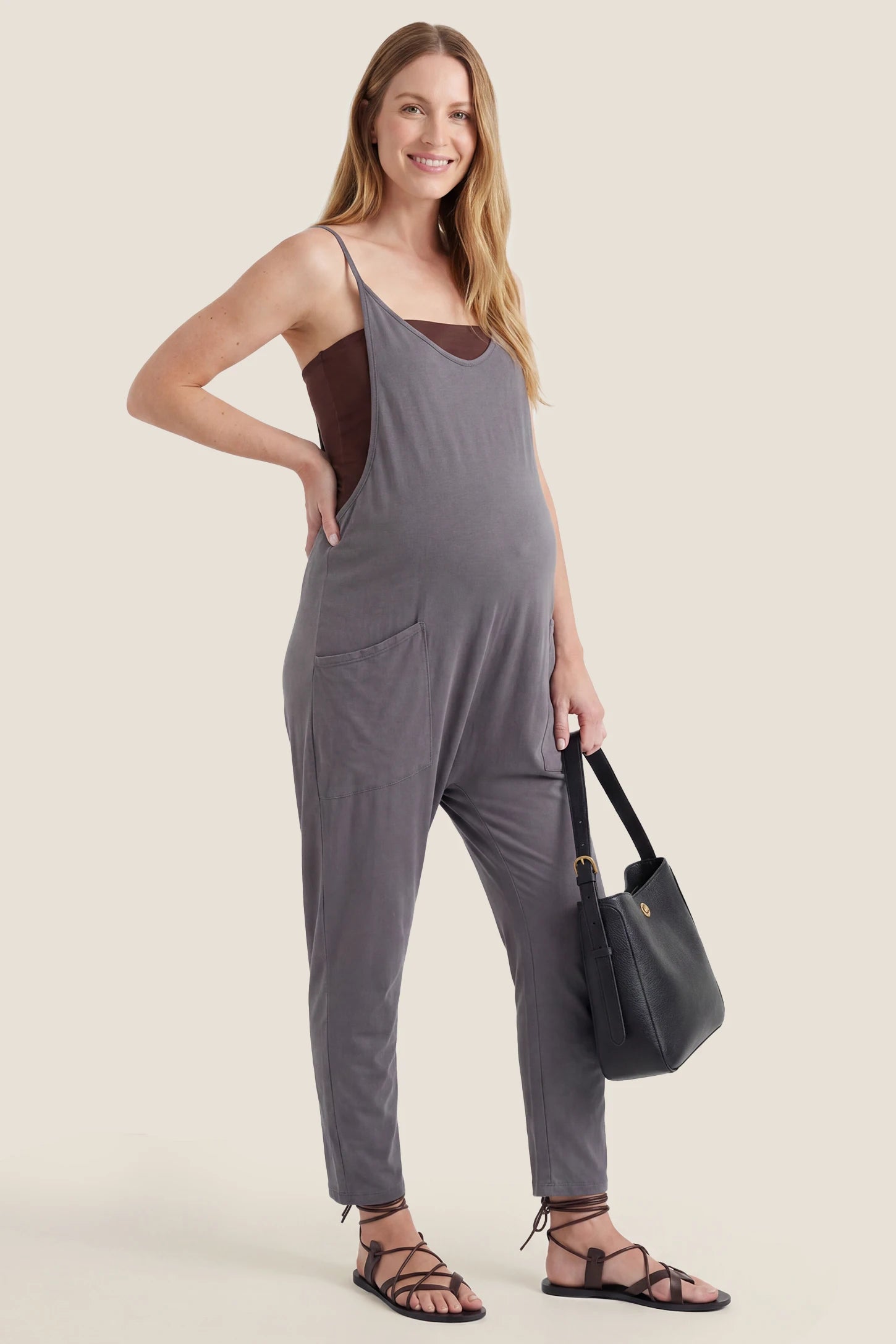 Adjustable Strap Pocketed Relaxed Maternity Jumpsuit Dark gray adjustable strap pocketed relaxed maternity jumpsuit styled with a casual everyday look