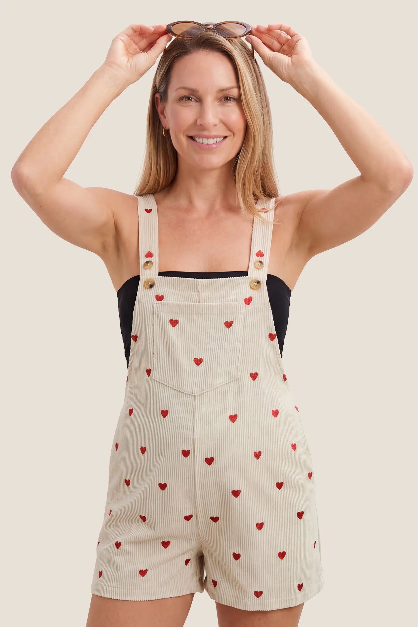 Adjustable Waist Front Pocket Maternity Short Overalls Maternity beige striped linen shortall overalls with red heart print, adjustable gold button straps, bump-friendly relaxed fit for pregnant women
