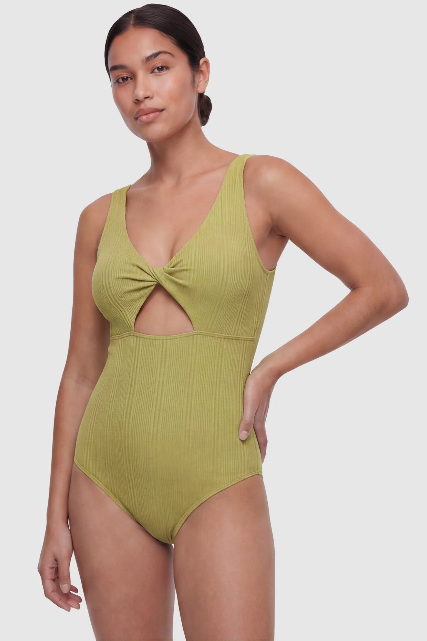 Cutout V-Neck Maternity Swimsuit Cutout V-Neck Maternity Swimsuit in Matcha featuring a front view of the quick-dry stretch fabric on a postpartum model.