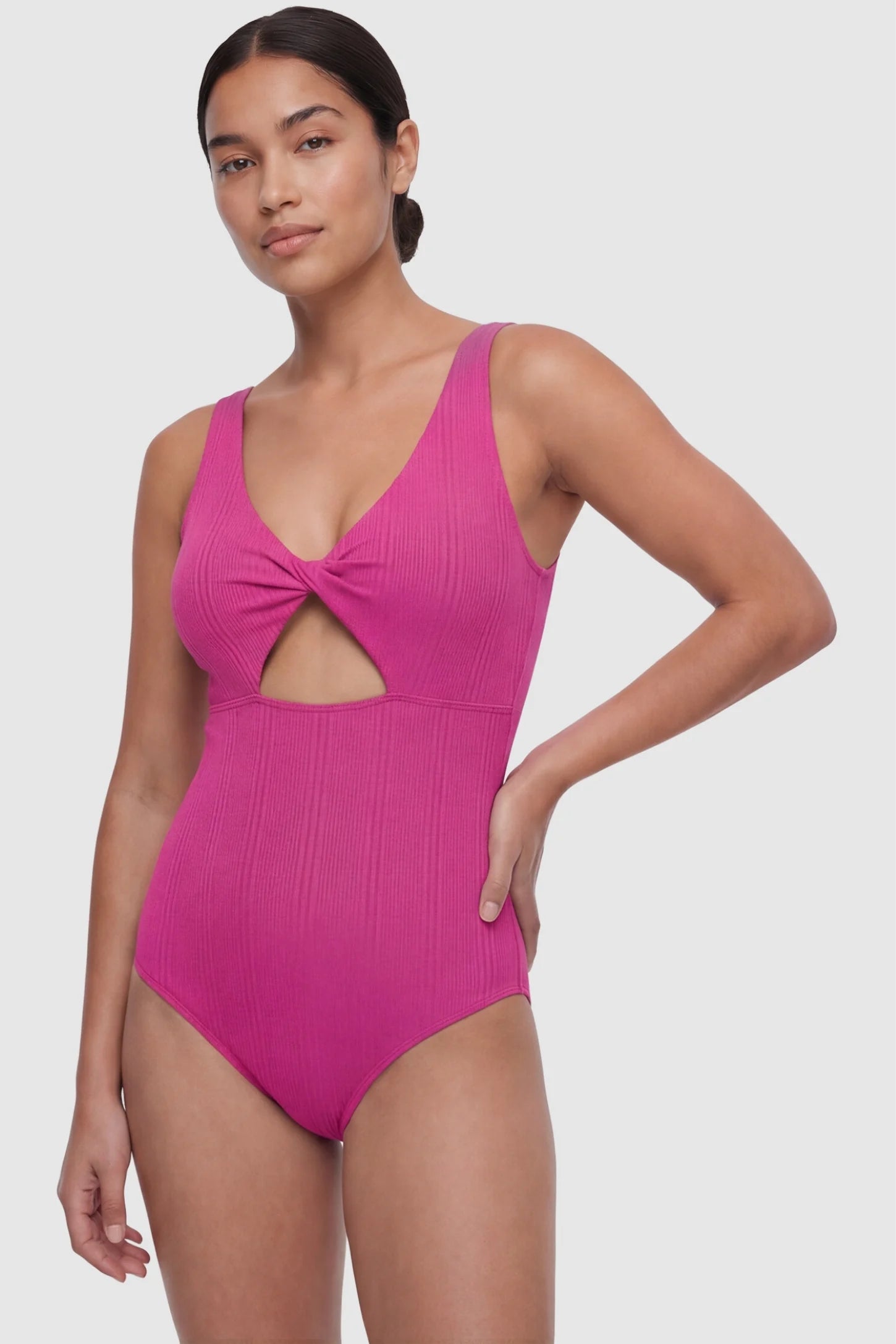 Cutout V-Neck Maternity Swimsuit Cutout V-Neck Maternity Swimsuit in Rose Red featuring a front view of the curve-hugging silhouette on a postpartum model.