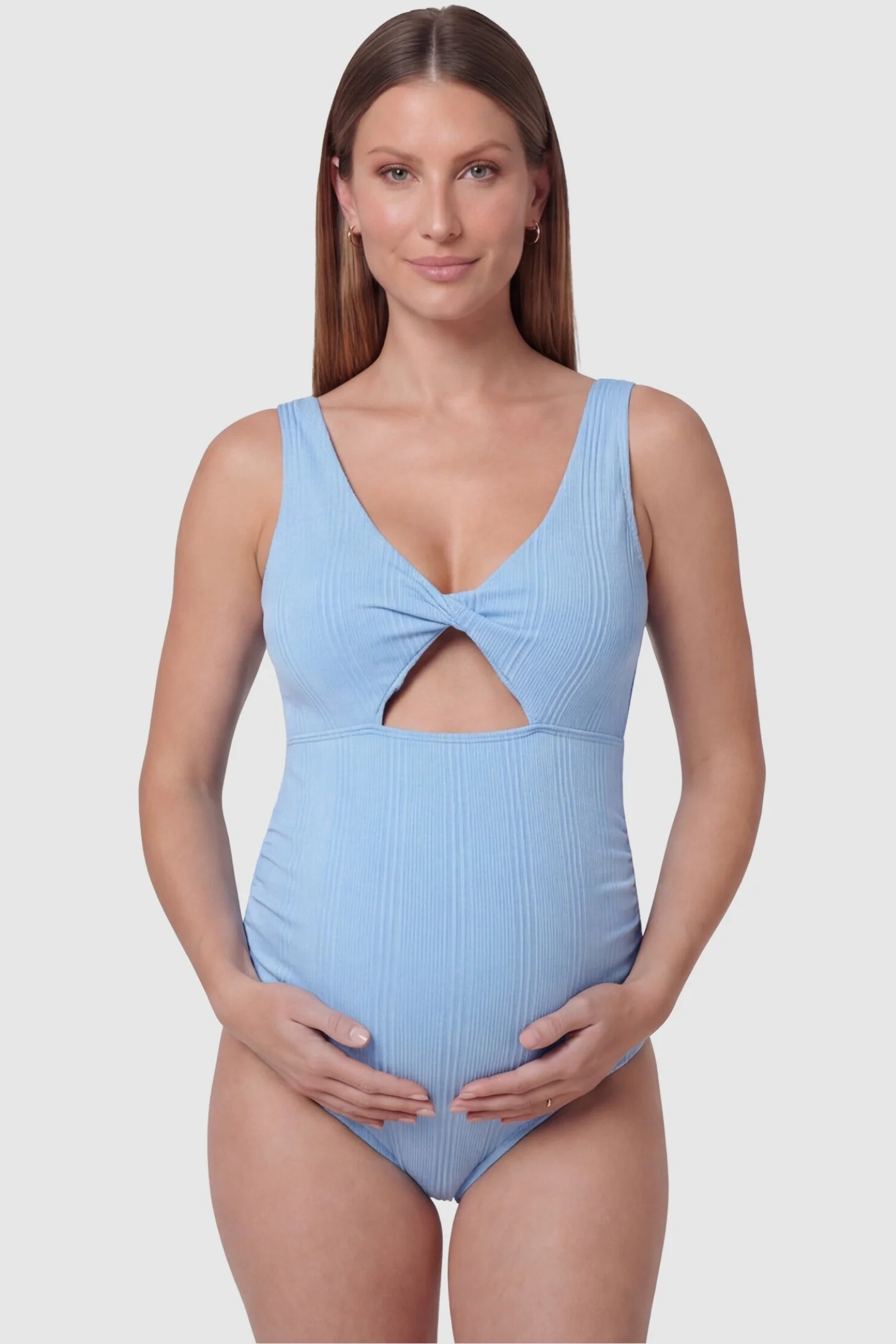 Cutout V-Neck Maternity Swimsuit Cutout V-Neck Maternity Swimsuit in Sky Blue featuring a front view of the reinforced v-neckline on a pregnant model.