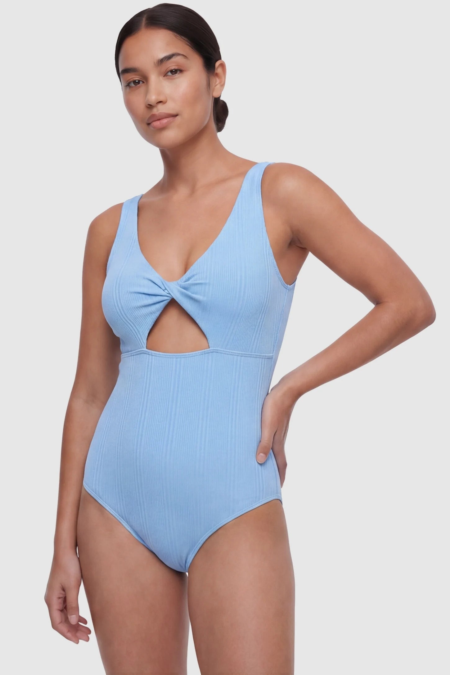 Cutout V-Neck Maternity Swimsuit Cutout V-Neck Maternity Swimsuit in Sky Blue featuring a front view of the high-retention stretch fabric on a postpartum model.