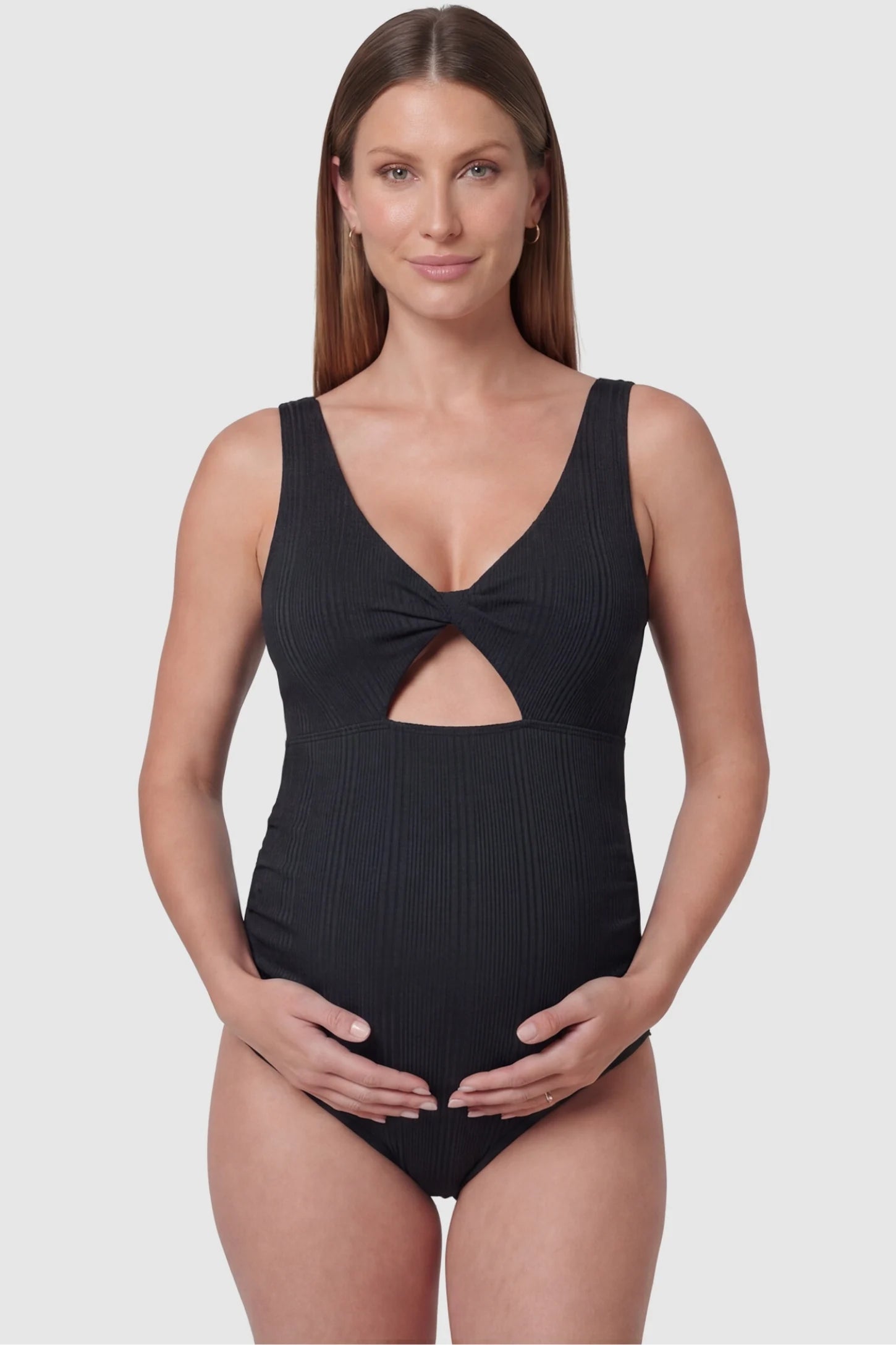 Cutout V-Neck Maternity Swimsuit in Black featuring a sophisticated front cutout on a pregnant model.