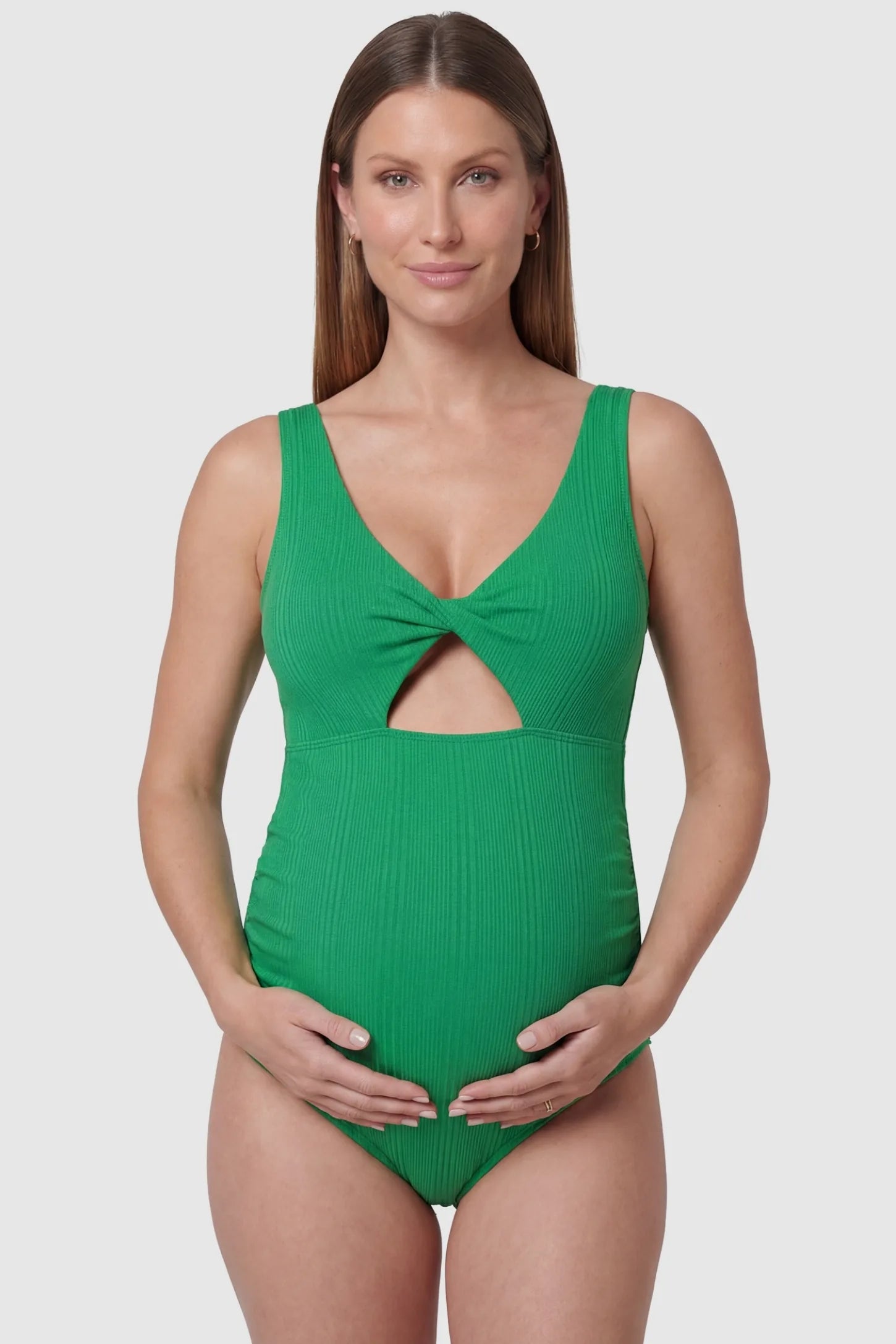 Cutout V-Neck Maternity Swimsuit Cutout V-Neck Maternity Swimsuit in Green featuring a front view of the wide-strap v-neck design on a pregnant model.