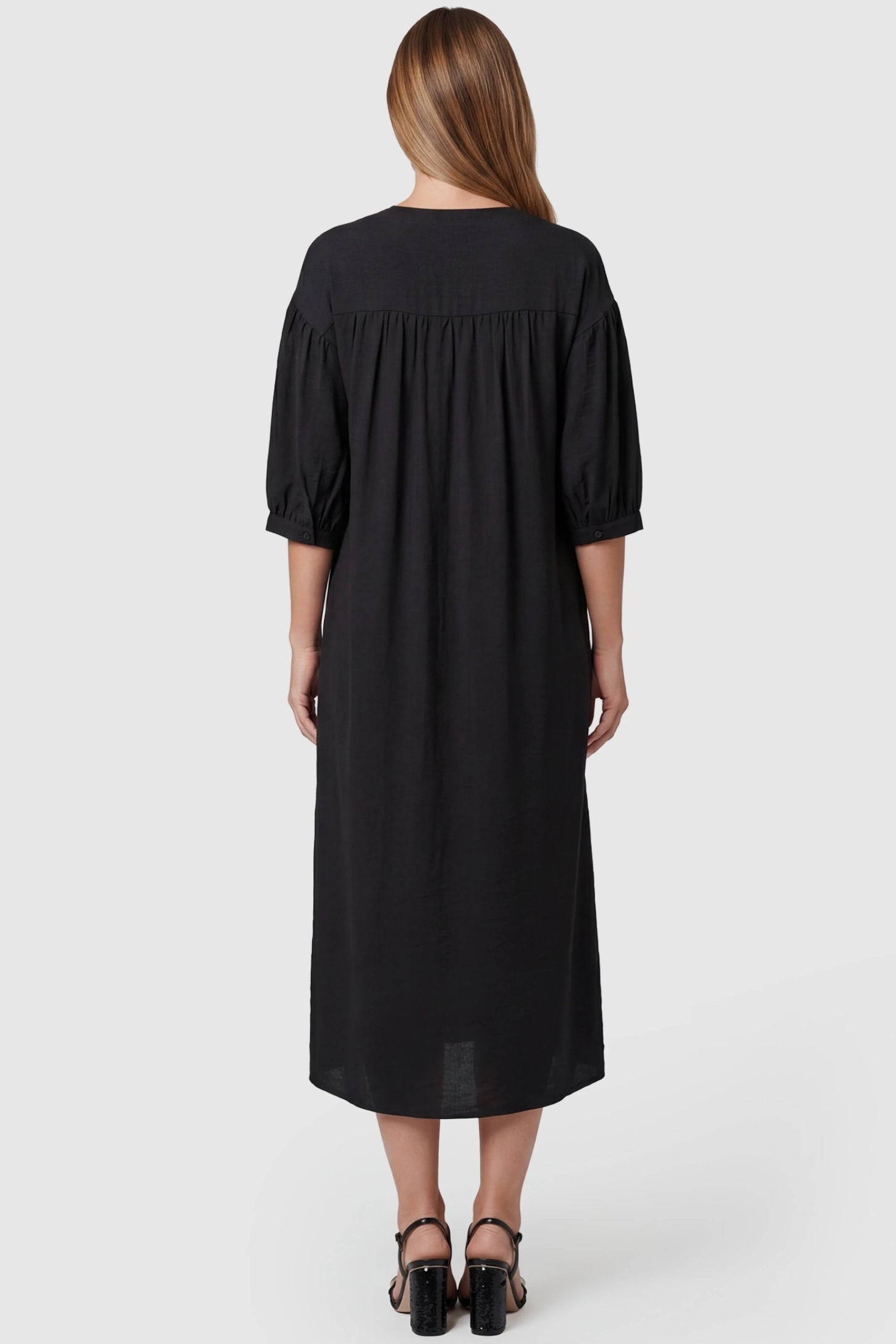 Embroidered Notched Half Sleeve Maternity Midi Dress Embroidered Notched Half Sleeve Maternity Midi Dress in Black featuring a gathered yoke back on a pregnant model.