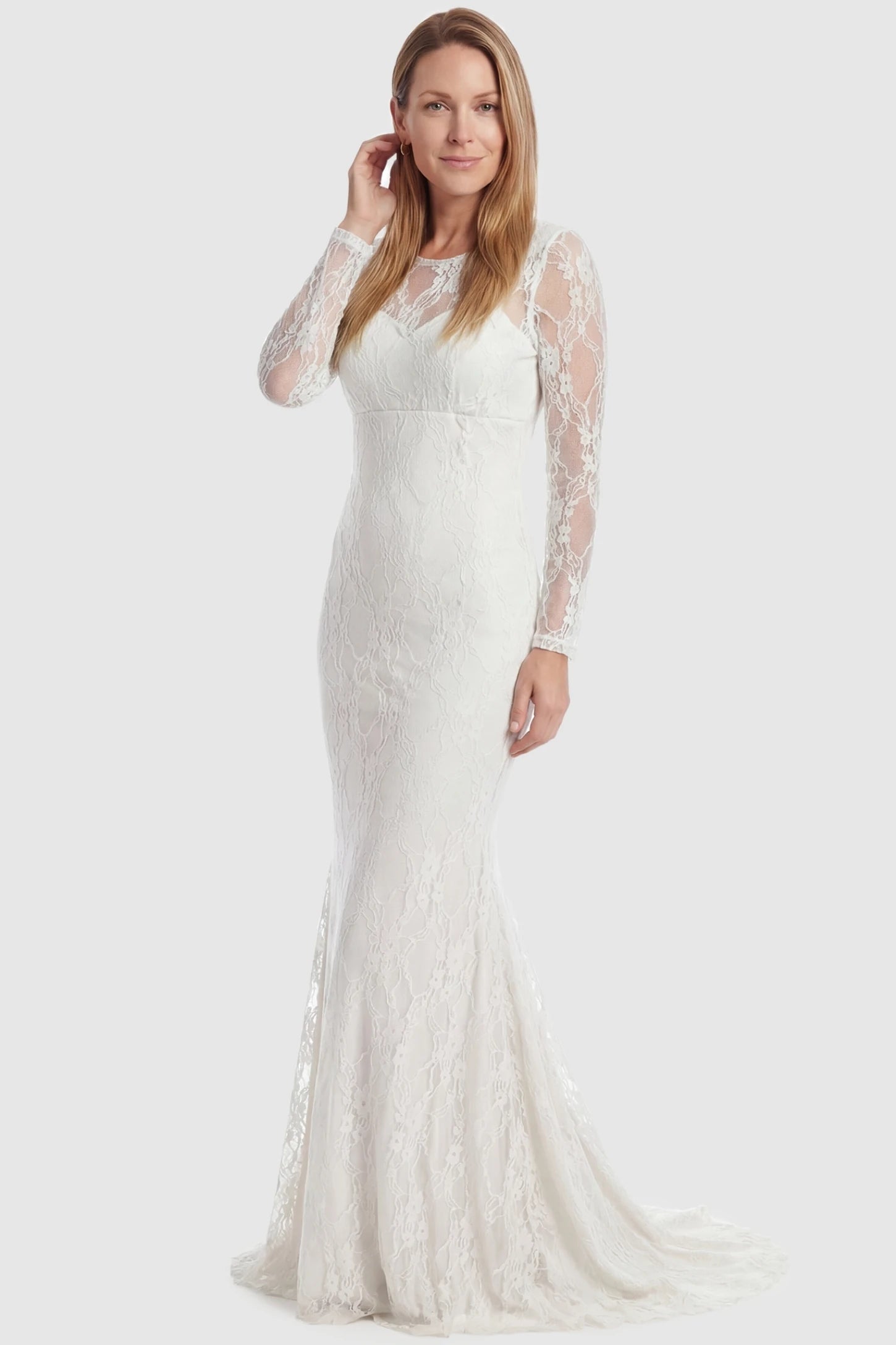 Floral Lace Long Sleeve Trumpet Maternity Photoshoot Gown Floral Lace Long Sleeve Trumpet Maternity Photoshoot Gown in White featuring a sheer round neckline on a postpartum model.