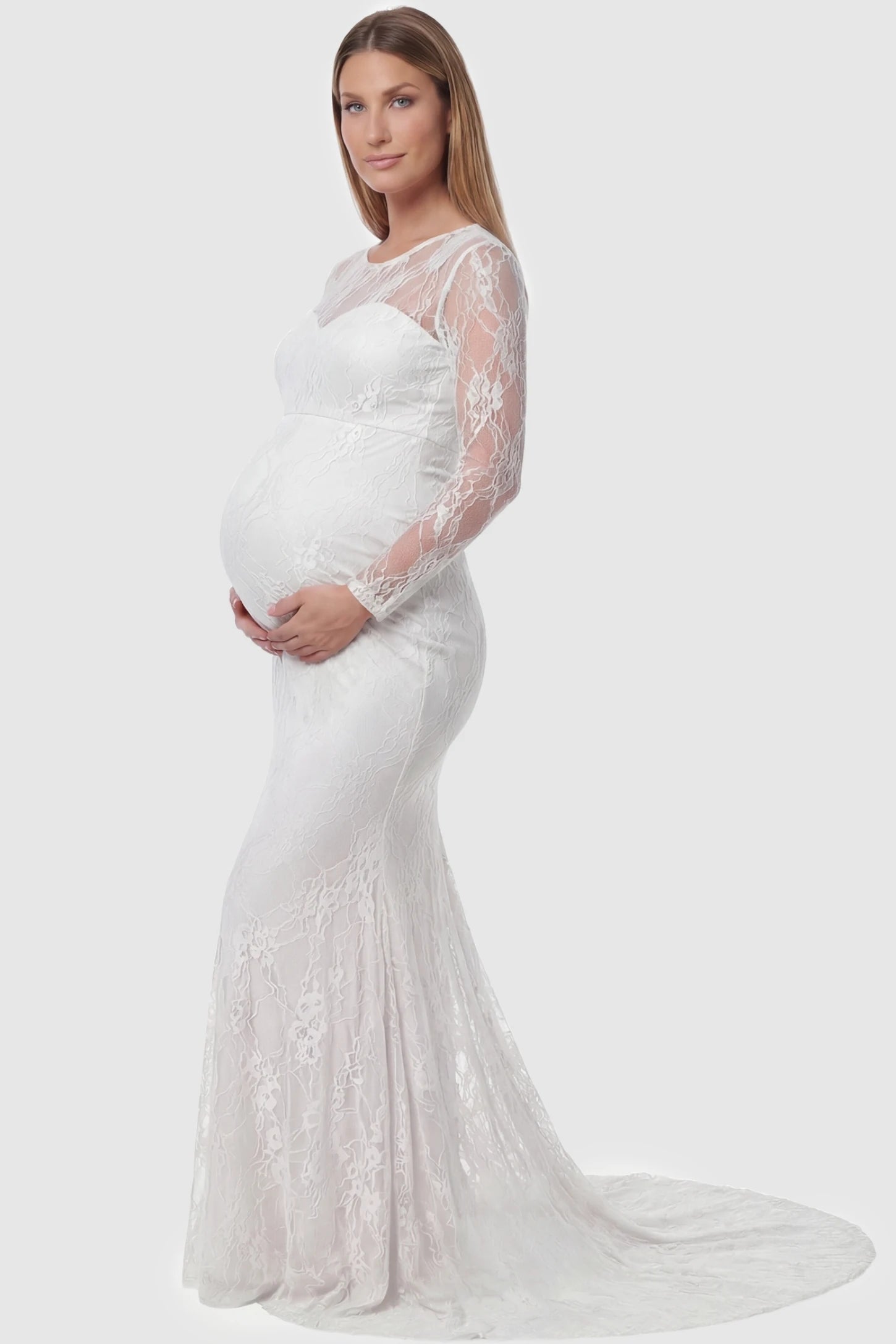 Floral Lace Long Sleeve Trumpet Maternity Photoshoot Gown Floral Lace Long Sleeve Trumpet Maternity Photoshoot Gown in White featuring a graceful trumpet flare on a pregnant model.