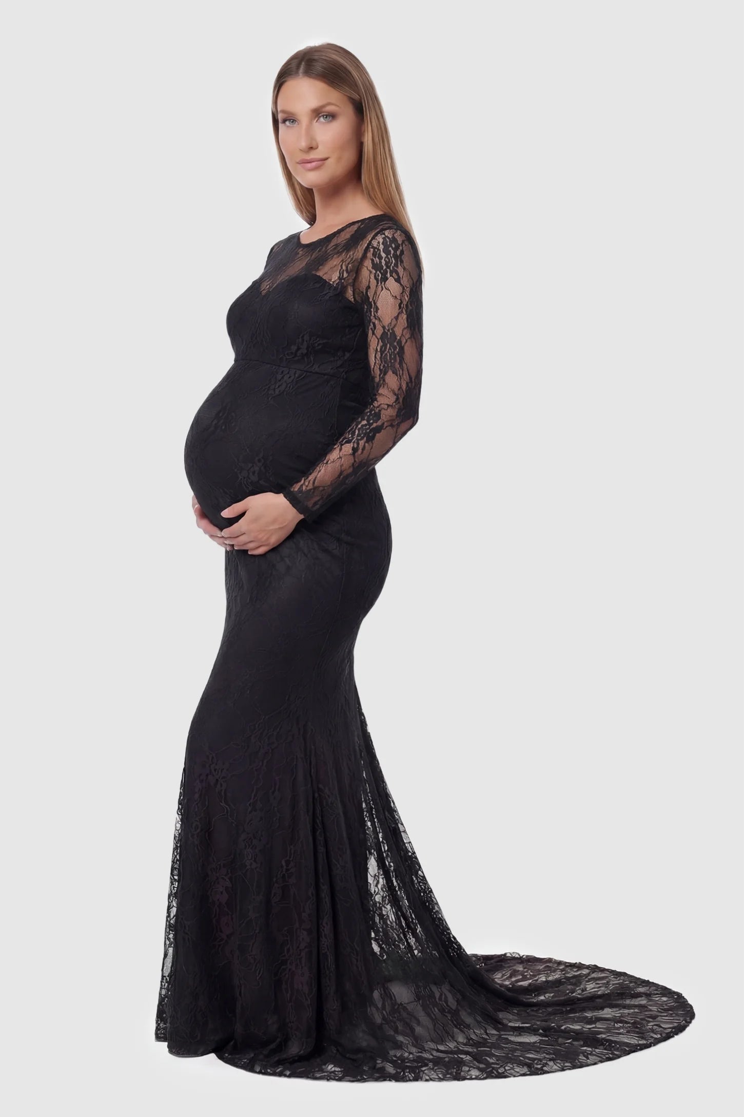 Floral Lace Long Sleeve Trumpet Maternity Photoshoot Gown Floral Lace Long Sleeve Trumpet Maternity Photoshoot Gown in Black featuring a dramatic trumpet flare on a pregnant model.