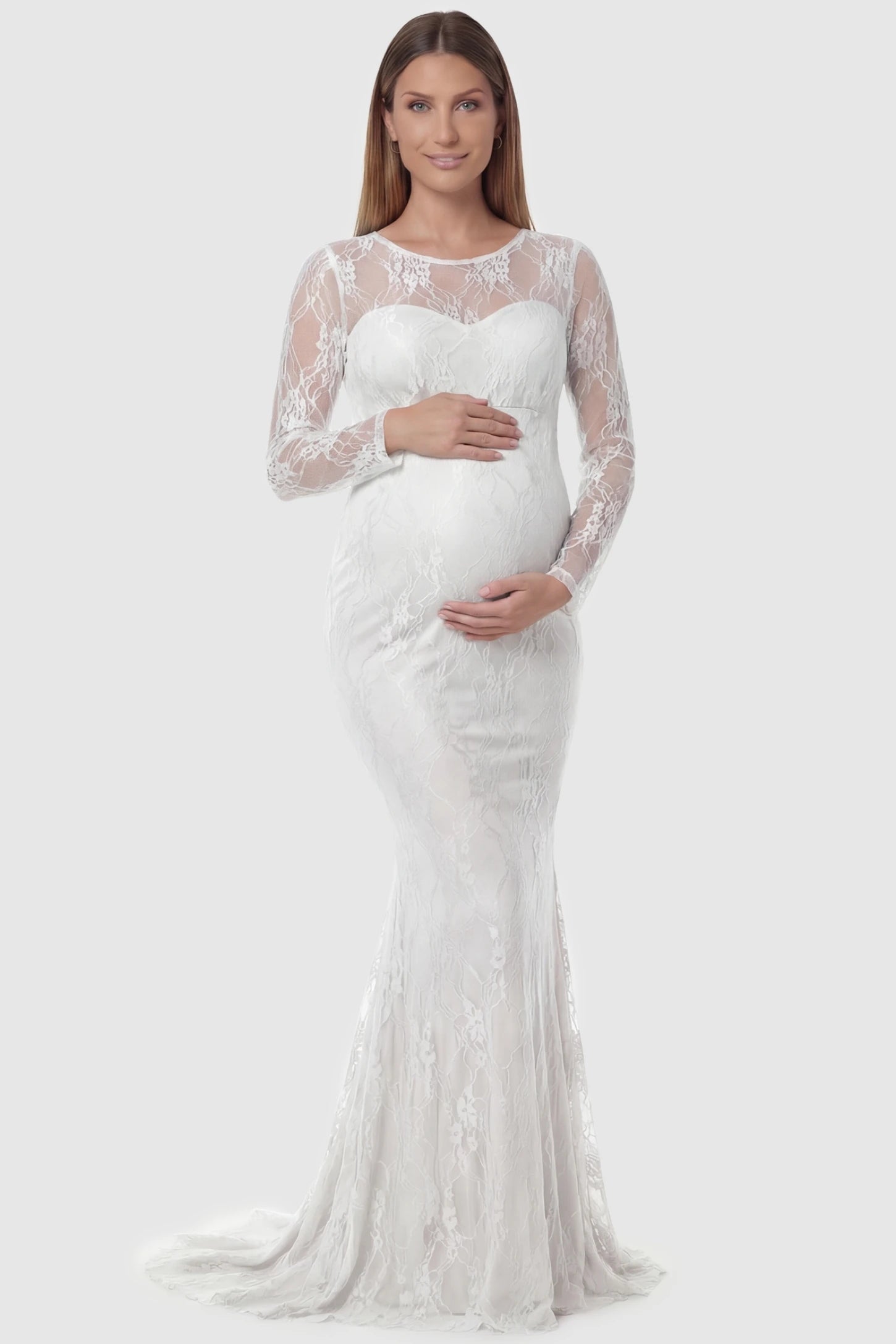 Floral Lace Long Sleeve Trumpet Maternity Photoshoot Gown Floral Lace Long Sleeve Trumpet Maternity Photoshoot Gown in White featuring a sheer round neckline on a pregnant model.