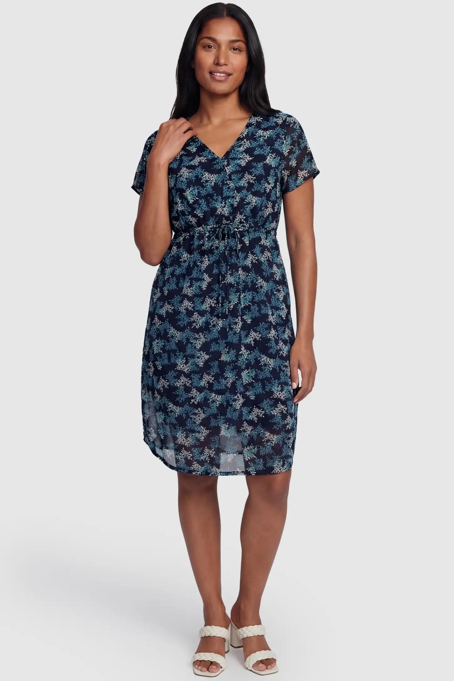 Floral V-Neck Knee-Length Maternity & Nursing Dress Floral V-Neck Knee-Length Maternity & Nursing Dress in Blue featuring a discrete concealed nursing opening on a non-pregnant model.