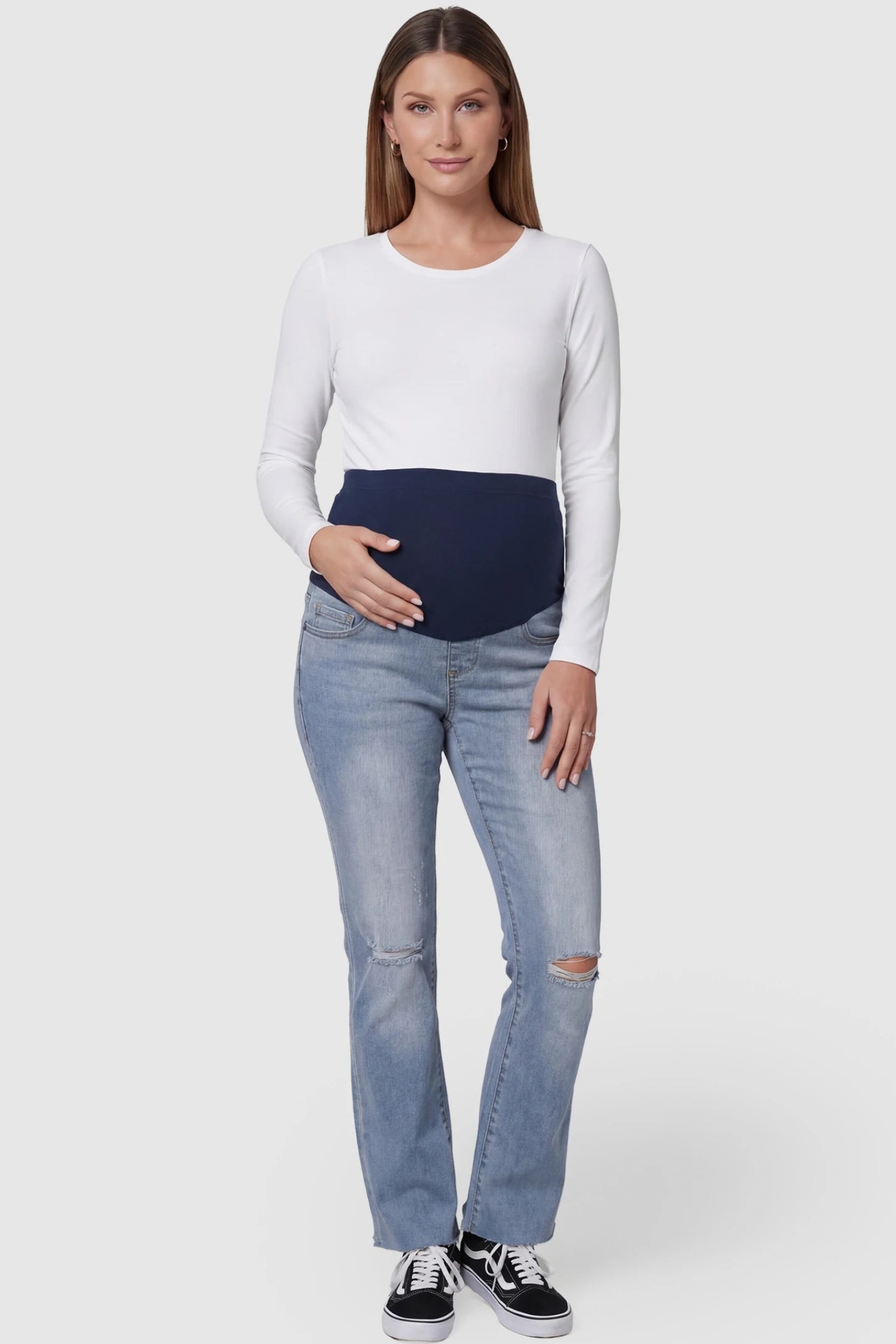 Knee Slit Wide Leg Maternity Jeans in Blue denim featuring a versatile retro-chic silhouette full body view on a pregnant model.