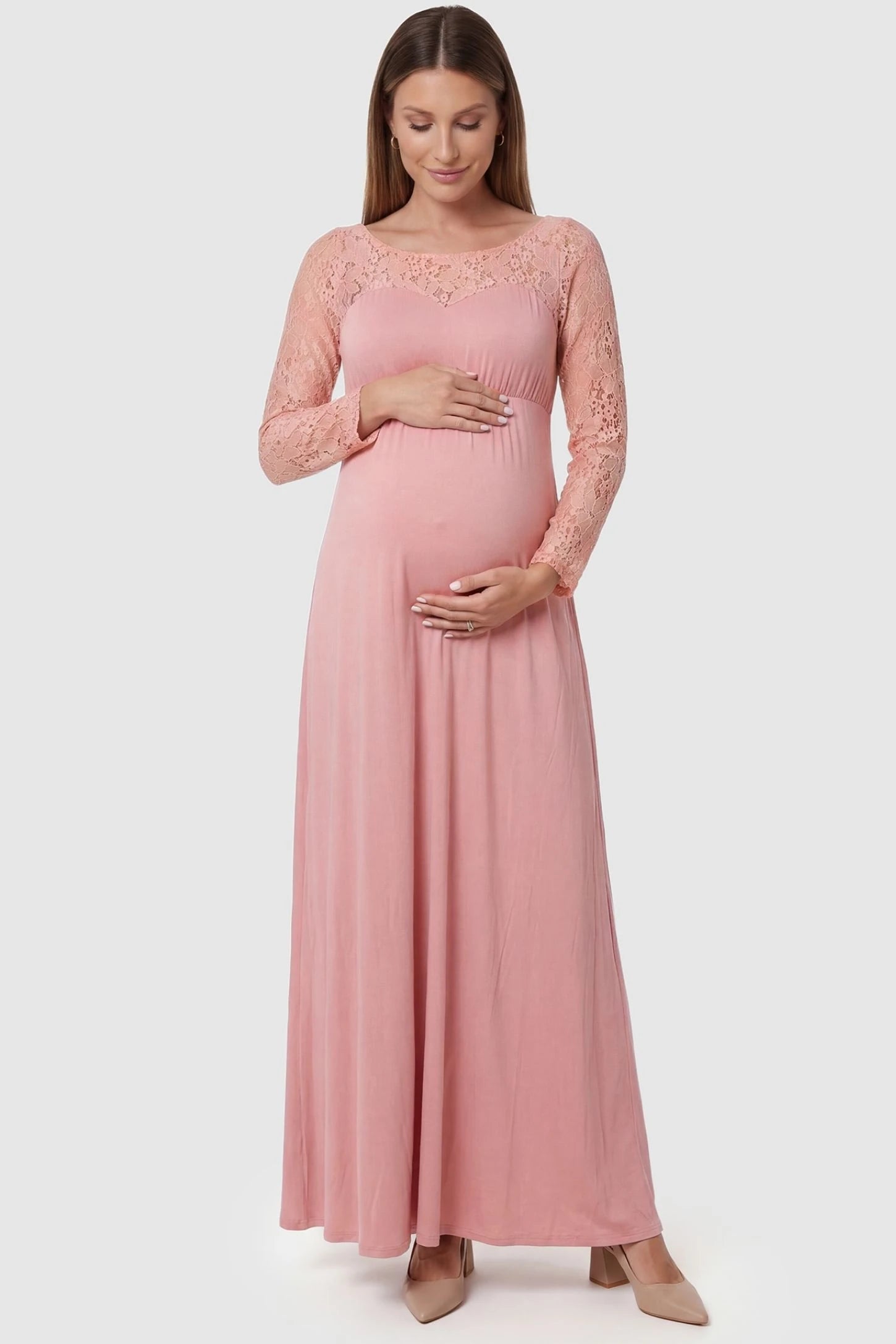 Acrylic Lace Long Sleeve Floor-Length Maternity Dress Acrylic Lace Long Sleeve Floor-Length Maternity Dress in Pink featuring a round neck on a front-facing pregnant model.