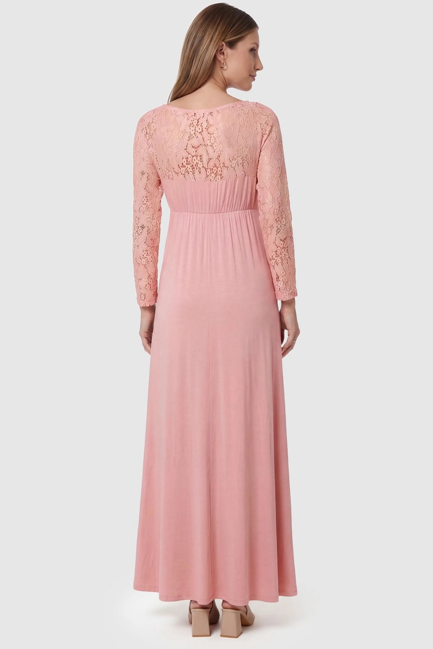 Acrylic Lace Long Sleeve Floor-Length Maternity Dress Acrylic Lace Long Sleeve Floor-Length Maternity Dress in Pink featuring a sheer lace back on a pregnant model, back view.