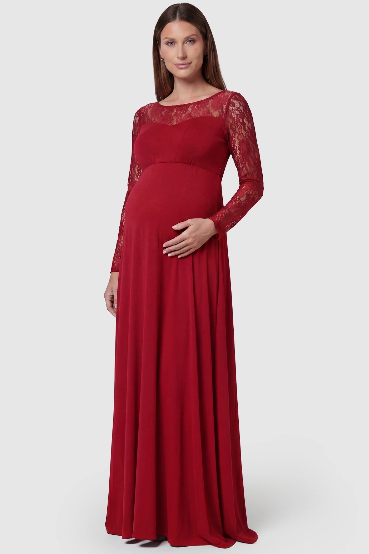 Acrylic Lace Long Sleeve Floor-Length Maternity Dress Acrylic Lace Long Sleeve Floor-Length Maternity Dress in Red featuring a round neck on a front-facing pregnant model.