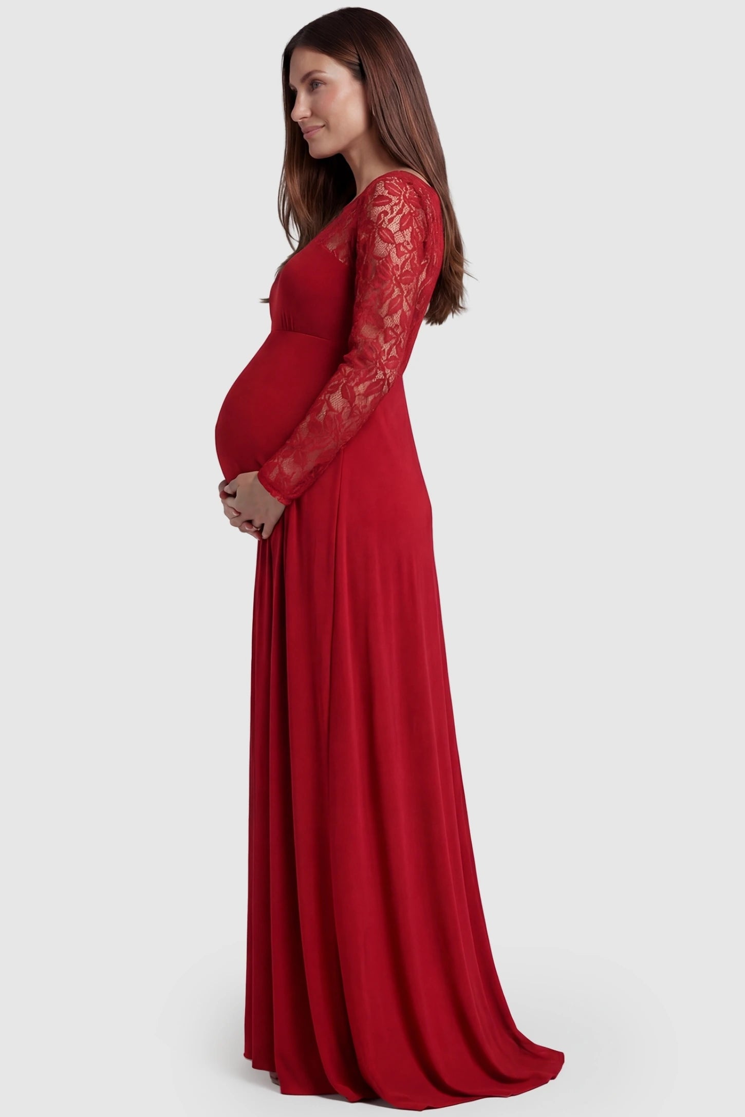 Acrylic Lace Long Sleeve Floor-Length Maternity Dress Acrylic Lace Long Sleeve Floor-Length Maternity Dress in Red featuring lace-spliced sleeves on a side-profile pregnant model.