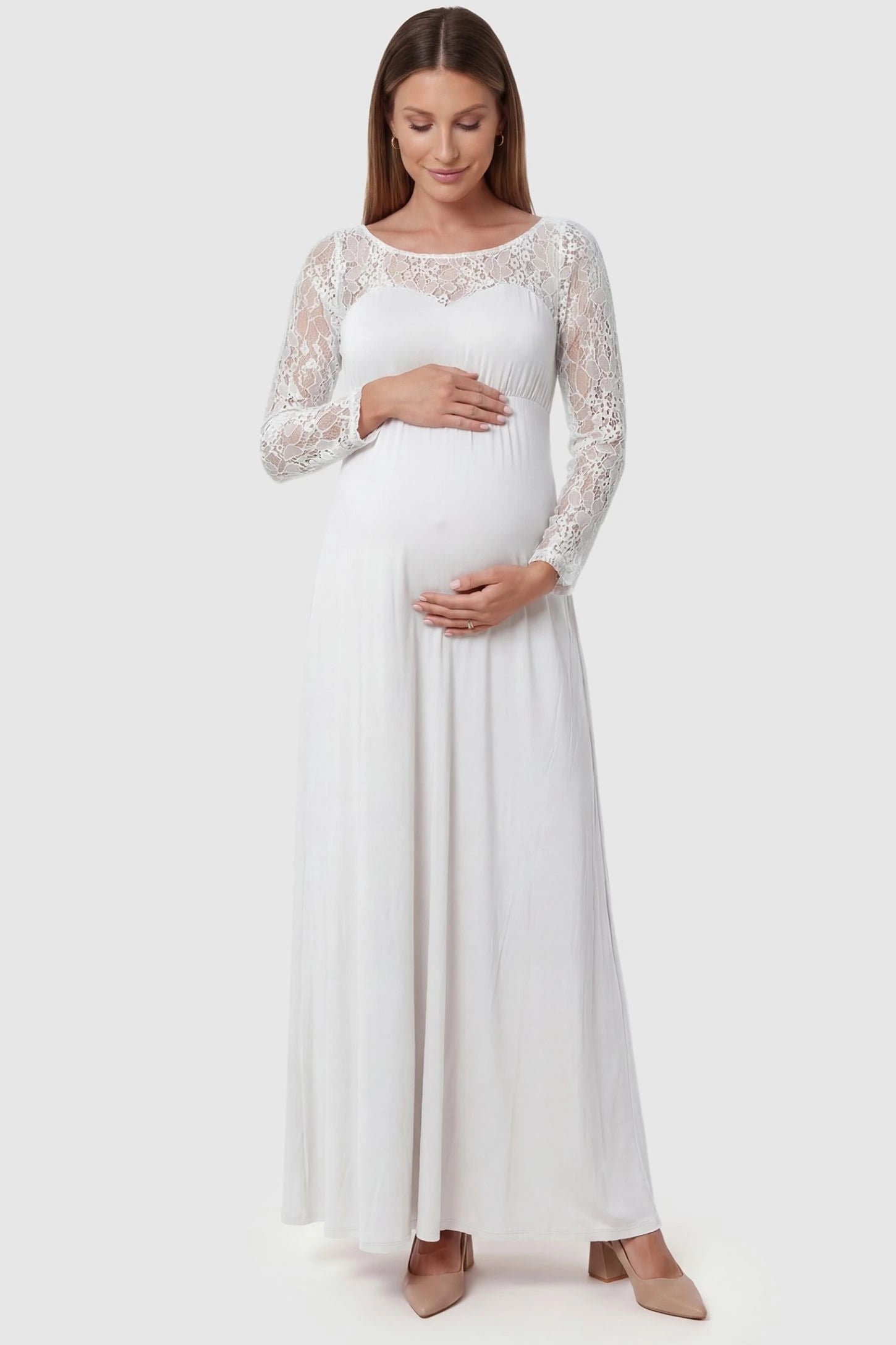 Acrylic Lace Long Sleeve Floor-Length Maternity Dress Acrylic Lace Long Sleeve Floor-Length Maternity Dress in White featuring a round neck on a front-facing pregnant model.