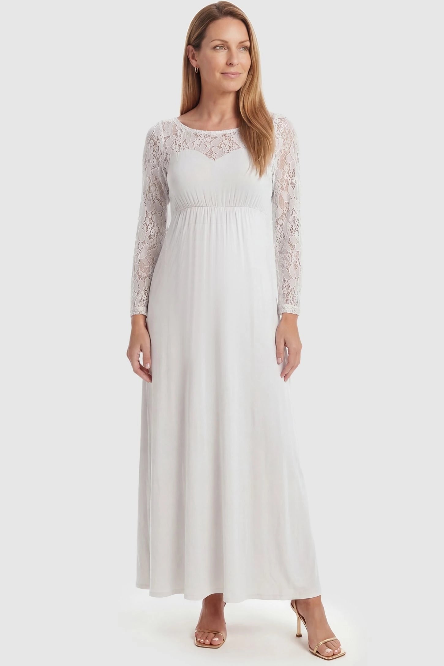 Acrylic Lace Long Sleeve Floor-Length Maternity Dress Acrylic Lace Long Sleeve Floor-Length Maternity Dress in White featuring a round neck on a front-facing non-pregnant model.