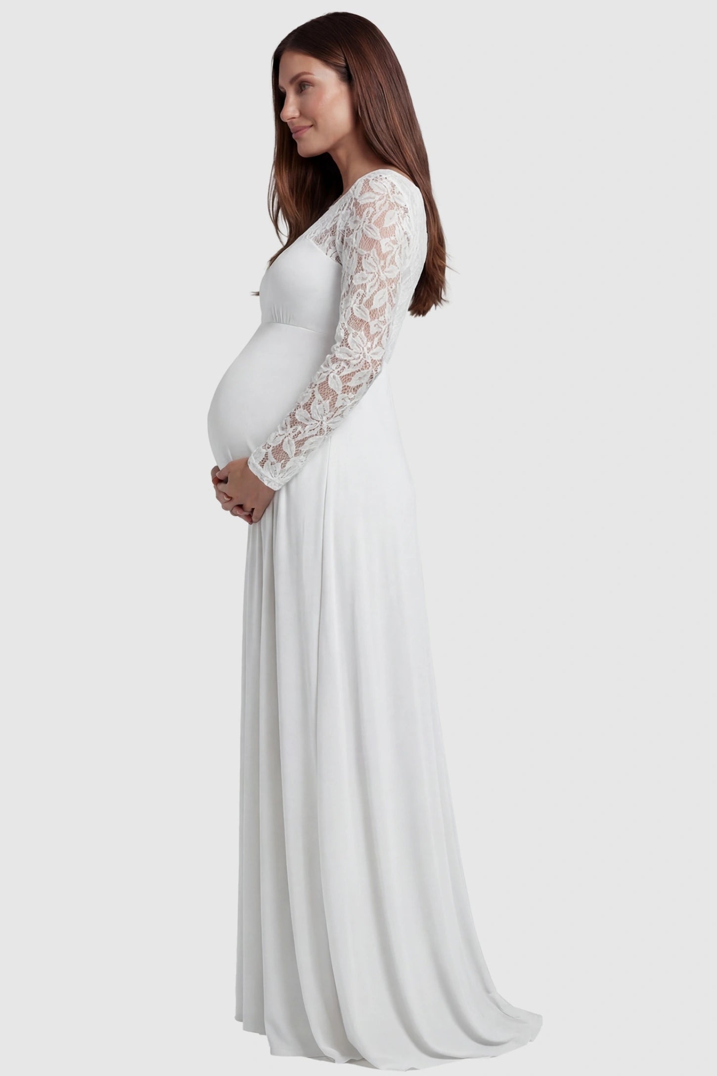 Acrylic Lace Long Sleeve Floor-Length Maternity Dress Acrylic Lace Long Sleeve Floor-Length Maternity Dress in White featuring lace-spliced sleeves on a side-profile pregnant model.