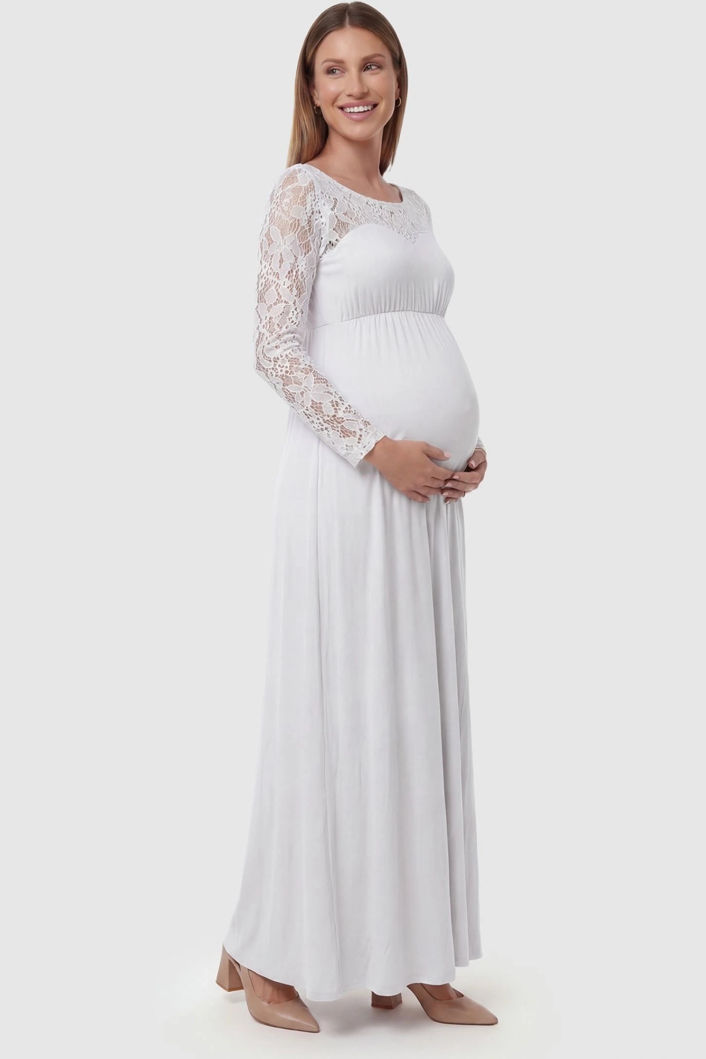Acrylic Lace Long Sleeve Floor-Length Maternity Dress Acrylic Lace Long Sleeve Floor-Length Maternity Dress in White featuring lace-spliced sleeves on a side-profile pregnant model.