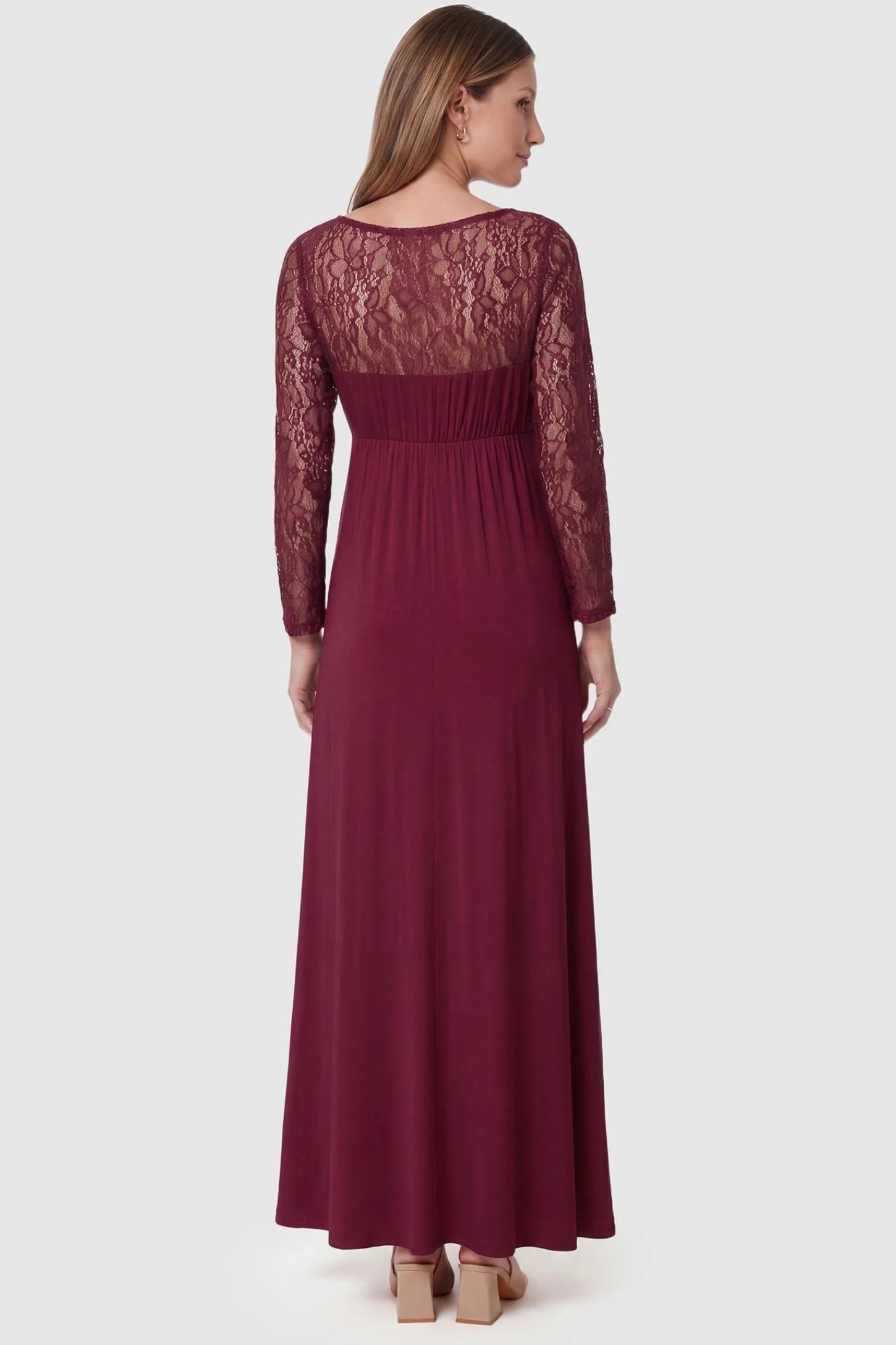 Acrylic Lace Long Sleeve Floor-Length Maternity Dress Acrylic Lace Long Sleeve Floor-Length Maternity Dress in Wine Red featuring a sheer lace back on a pregnant model, back view.