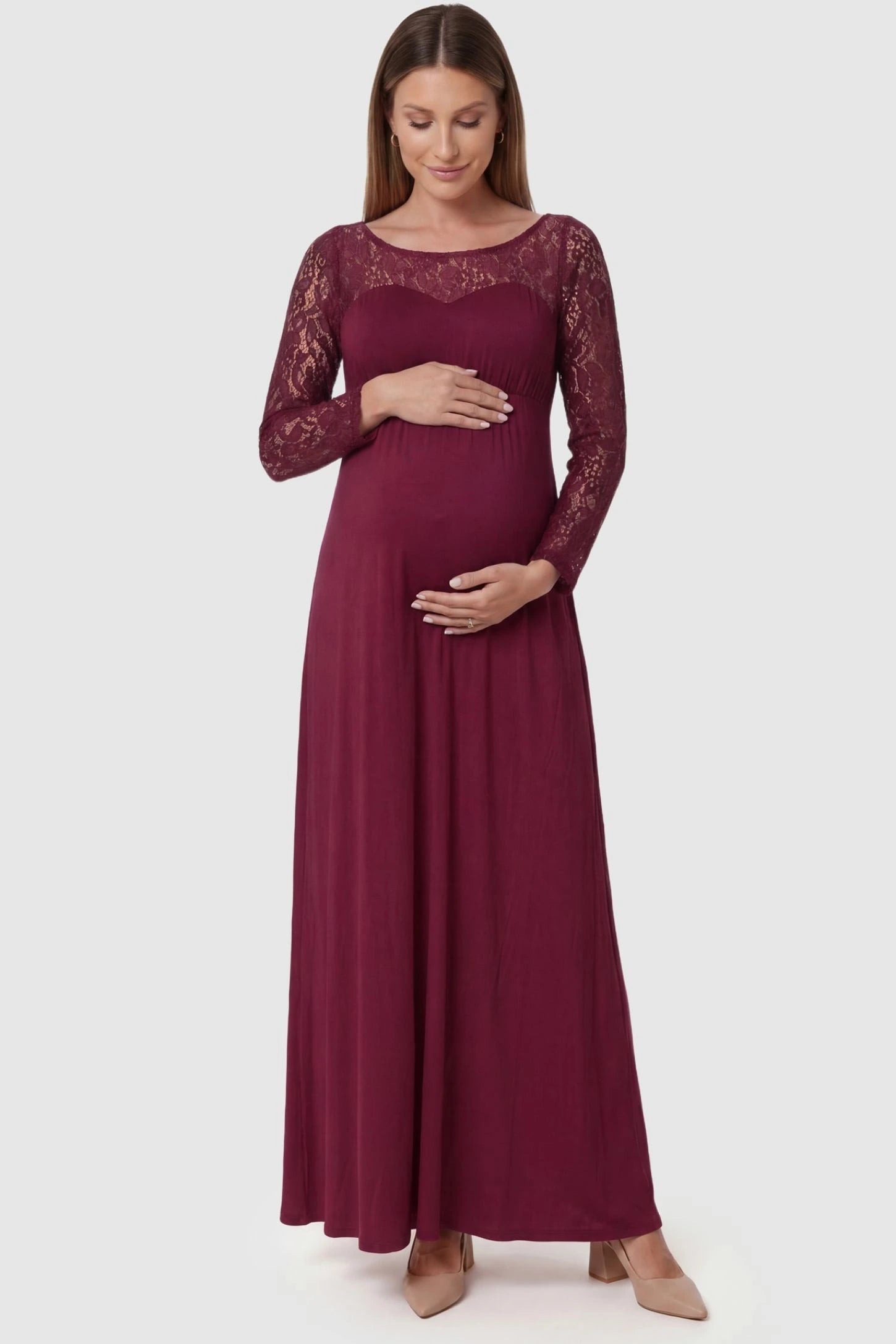 Acrylic Lace Long Sleeve Floor-Length Maternity Dress Acrylic Lace Long Sleeve Floor-Length Maternity Dress in Wine Red featuring a round neck on a front-facing pregnant model.
