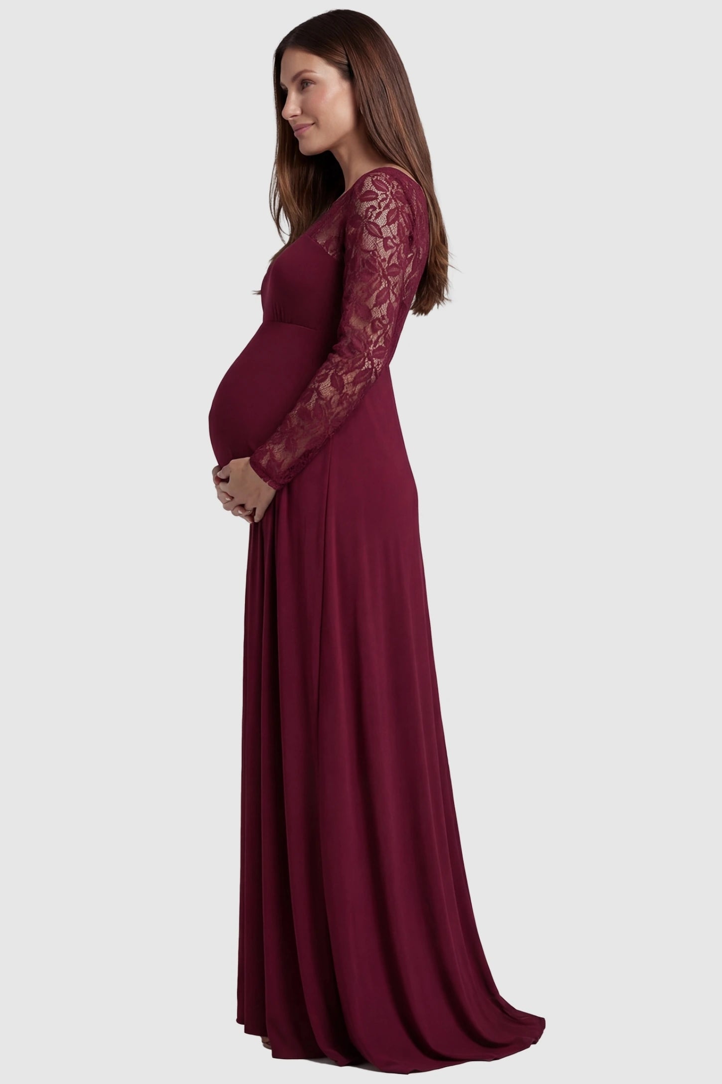 Acrylic Lace Long Sleeve Floor-Length Maternity Dress Acrylic Lace Long Sleeve Floor-Length Maternity Dress in Wine Red  featuring lace-spliced sleeves on a side-profile pregnant model.