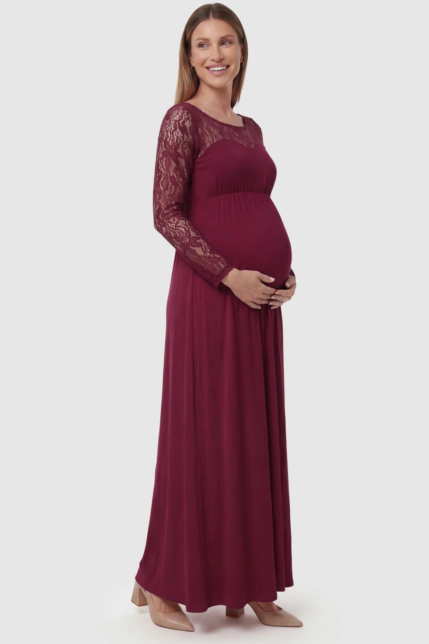 Acrylic Lace Long Sleeve Floor-Length Maternity Dress Acrylic Lace Long Sleeve Floor-Length Maternity Dress in Wine Red  featuring lace-spliced sleeves on a side-profile pregnant model.