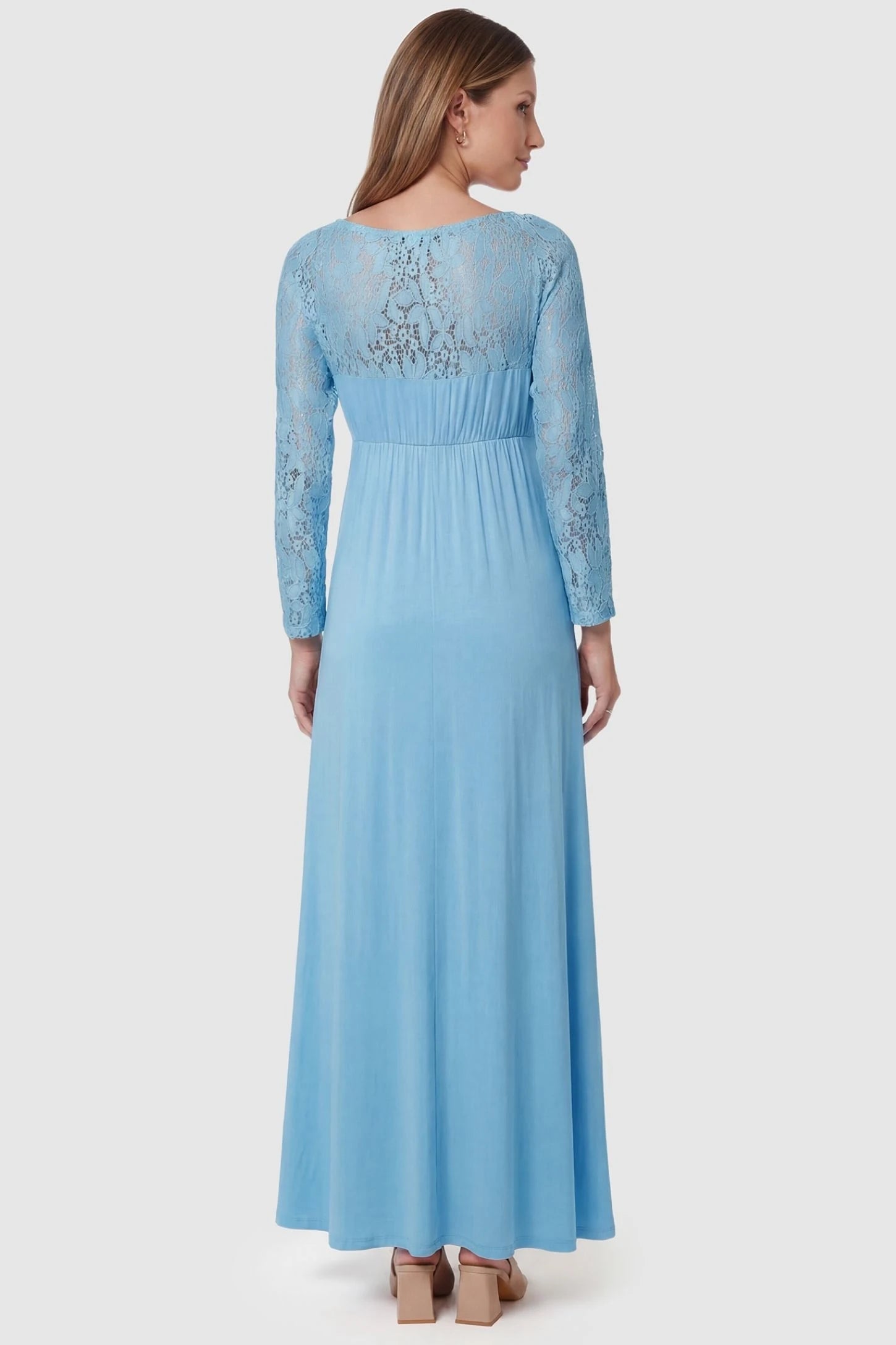 Acrylic Lace Long Sleeve Floor-Length Maternity Dress Acrylic Lace Long Sleeve Floor-Length Maternity Dress in Light Blue featuring a sheer lace back on a pregnant model, back view.