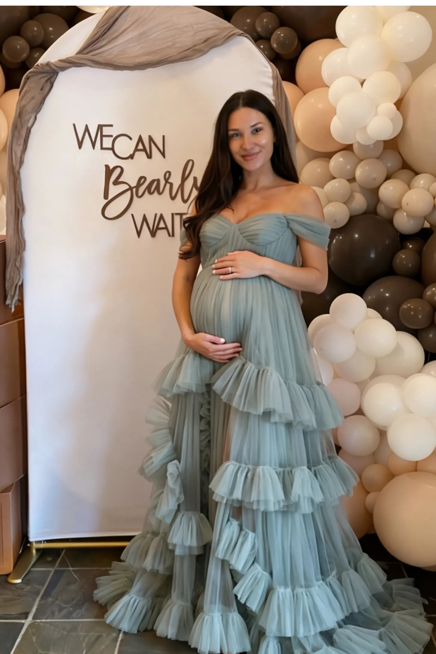 Emerald Green Multi-Layered Tulle Fit & Flare Maternity Gown with voluminous tulle layers on a pregnant model at a baby shower.