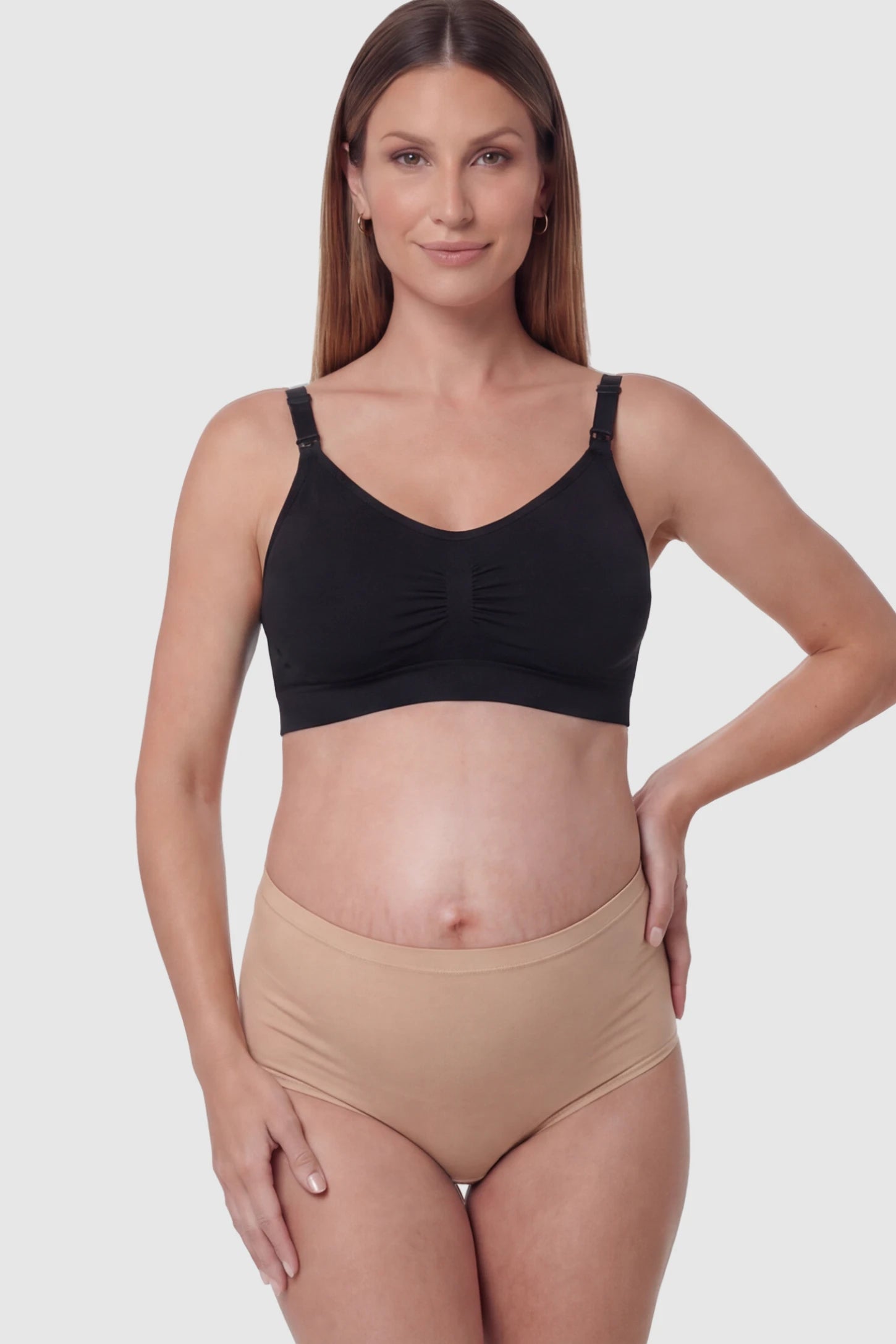 Seamless Ruched Front Wireless Maternity Nursing Bra Seamless Ruched Wireless Nursing Bra in Black with one-handed clips and adaptive stretch on a pregnant model.