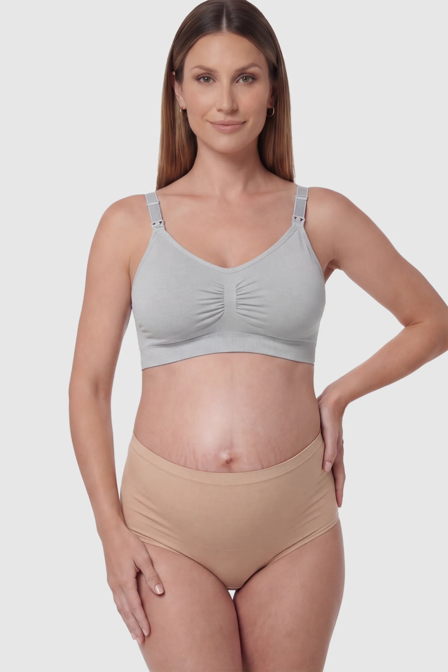 Seamless Ruched Front Wireless Maternity Nursing Bra Seamless Ruched Wireless Nursing Bra in Gray with one-handed clips and adaptive stretch on a pregnant model.