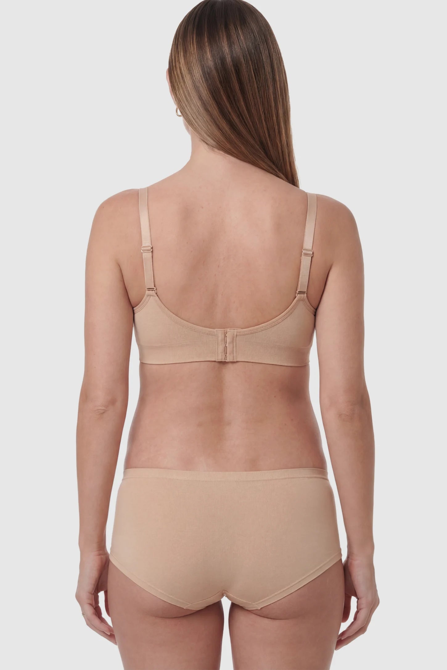 Seamless Ruched Wireless Nursing Bra in Lotus Root Pink on a pregnant model.