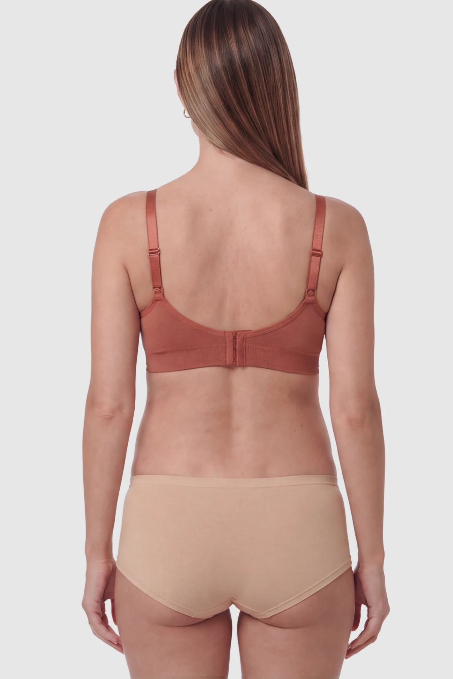 Seamless Ruched Front Wireless Maternity Nursing Bra Seamless Ruched Wireless Nursing Bra in Wine Red on a pregnant model.