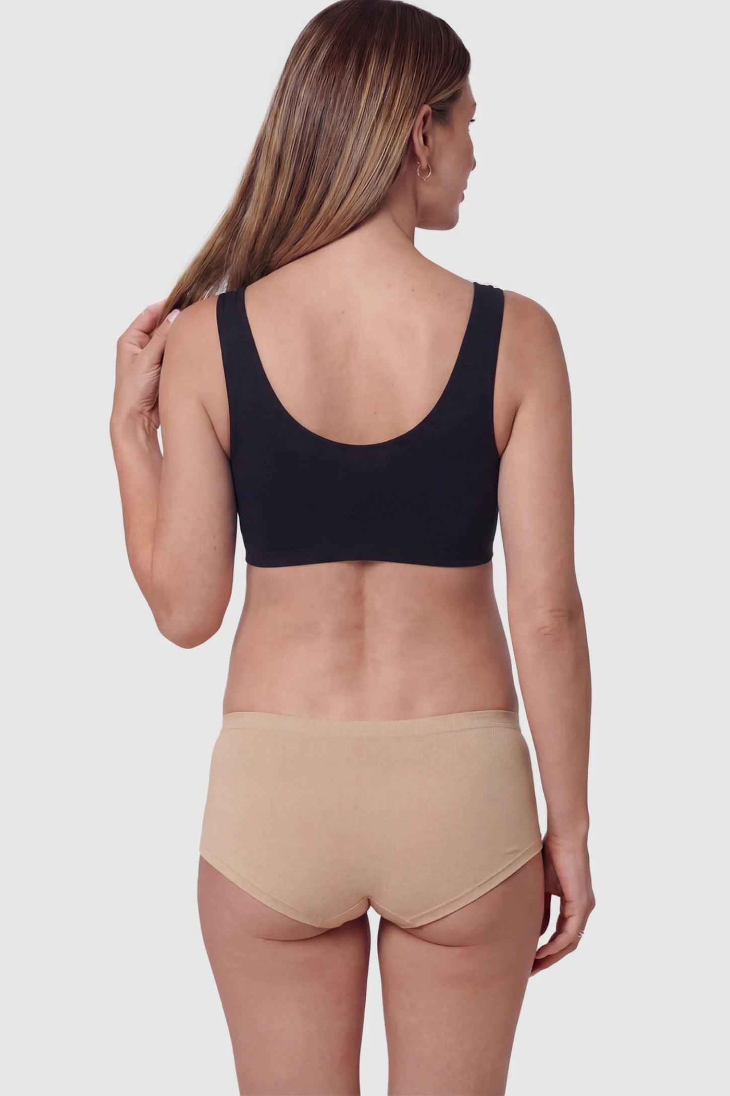 Cotton Blend Crossover Maternity Nursing Bra in Black on a pregnant model.