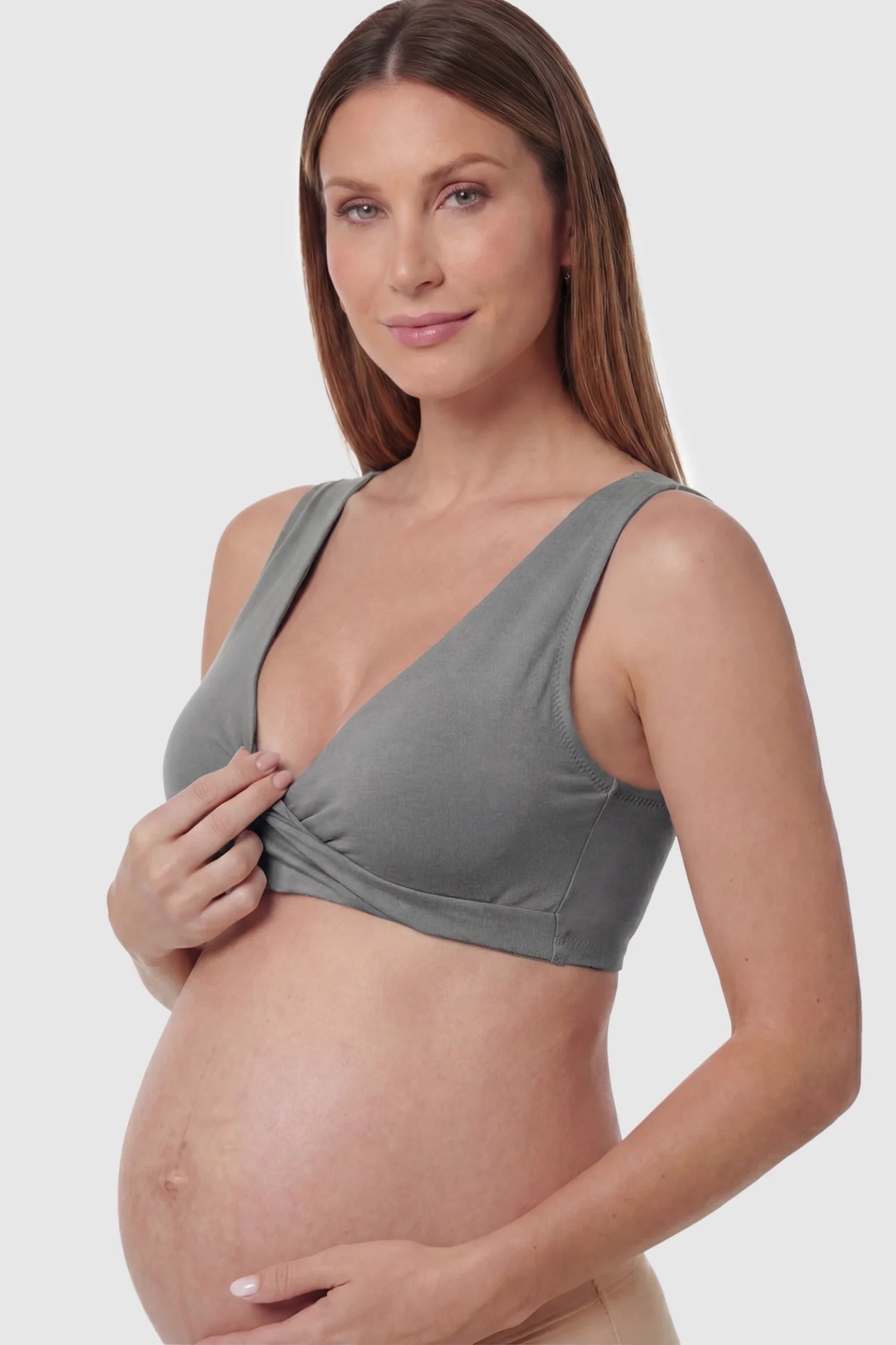 Cotton Blend Crossover Maternity Nursing Bra Cotton Blend Crossover Maternity Nursing Bra in Dark Gray featuring a wire-free wrap front on a pregnant model.