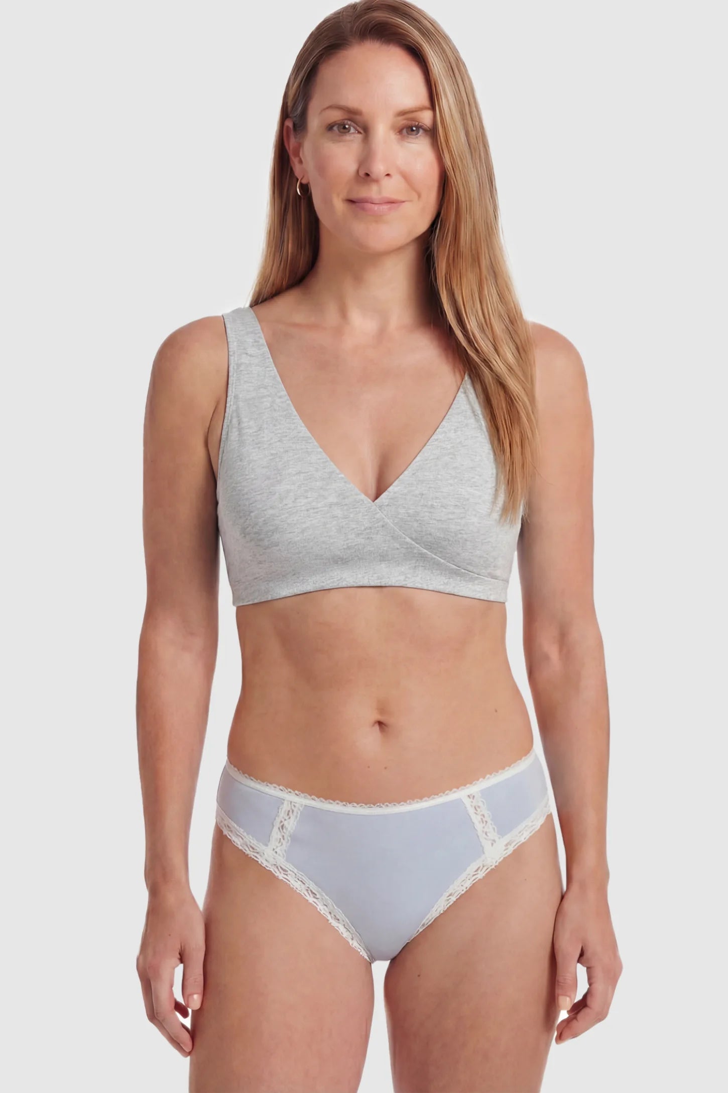 Cotton Blend Crossover Maternity Nursing Bra Cotton Blend Crossover Maternity Nursing Bra in Light Gray featuring a wire-free wrap front on a postpartum model.