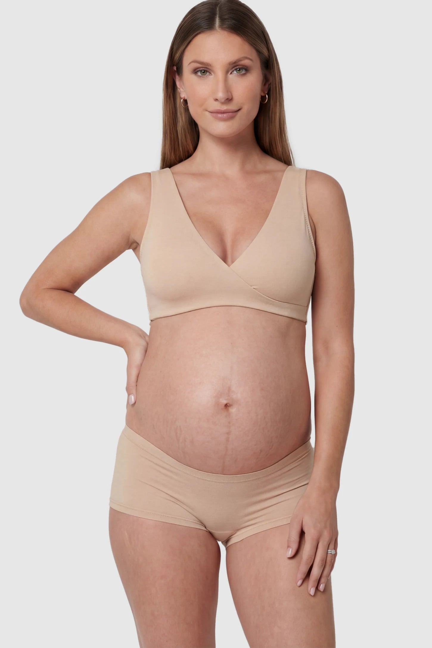 Cotton Blend Crossover Maternity Nursing Bra Cotton Blend Crossover Maternity Nursing Bra in Skin featuring a wire-free wrap front on a pregnant model.