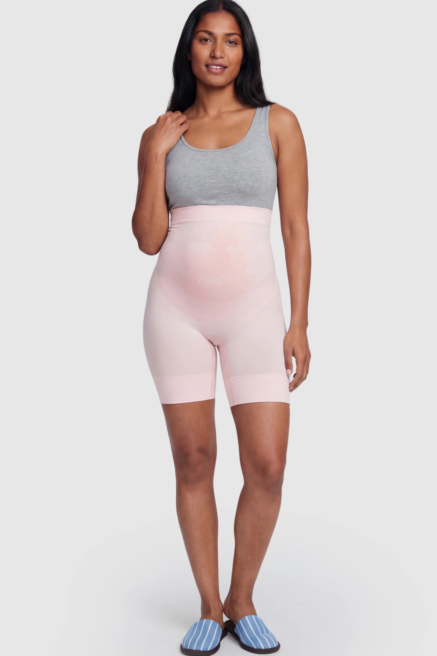 Seamless High Waist Support Maternity Shapewear Shorts Seamless High Waist Support Maternity Shapewear Shorts in pink Color featuring over-the-belly panel on a postpartum model.
