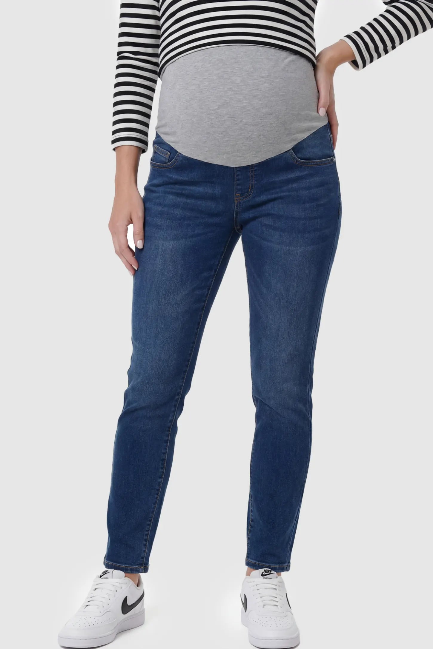 Adjustable Elastic Waist Straight Leg Maternity Jeans in Vintage Blue featuring an over-the-bump jersey panel on a pregnant model.