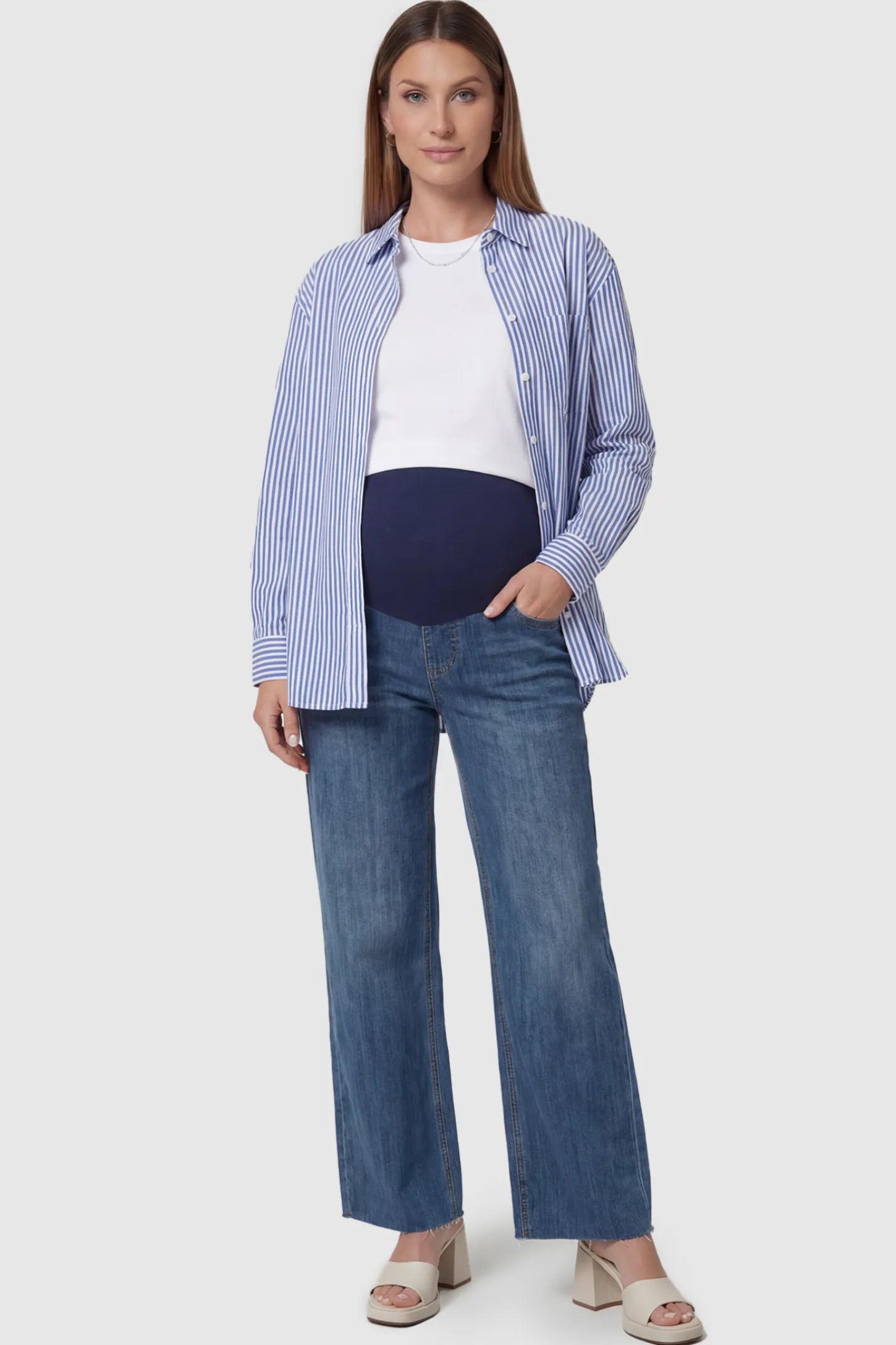 Full Panel Wide Leg Maternity Jeans Full Panel Wide Leg Maternity Jeans in Dark Blue featuring a seamless tummy-support band on a pregnant model facing front.